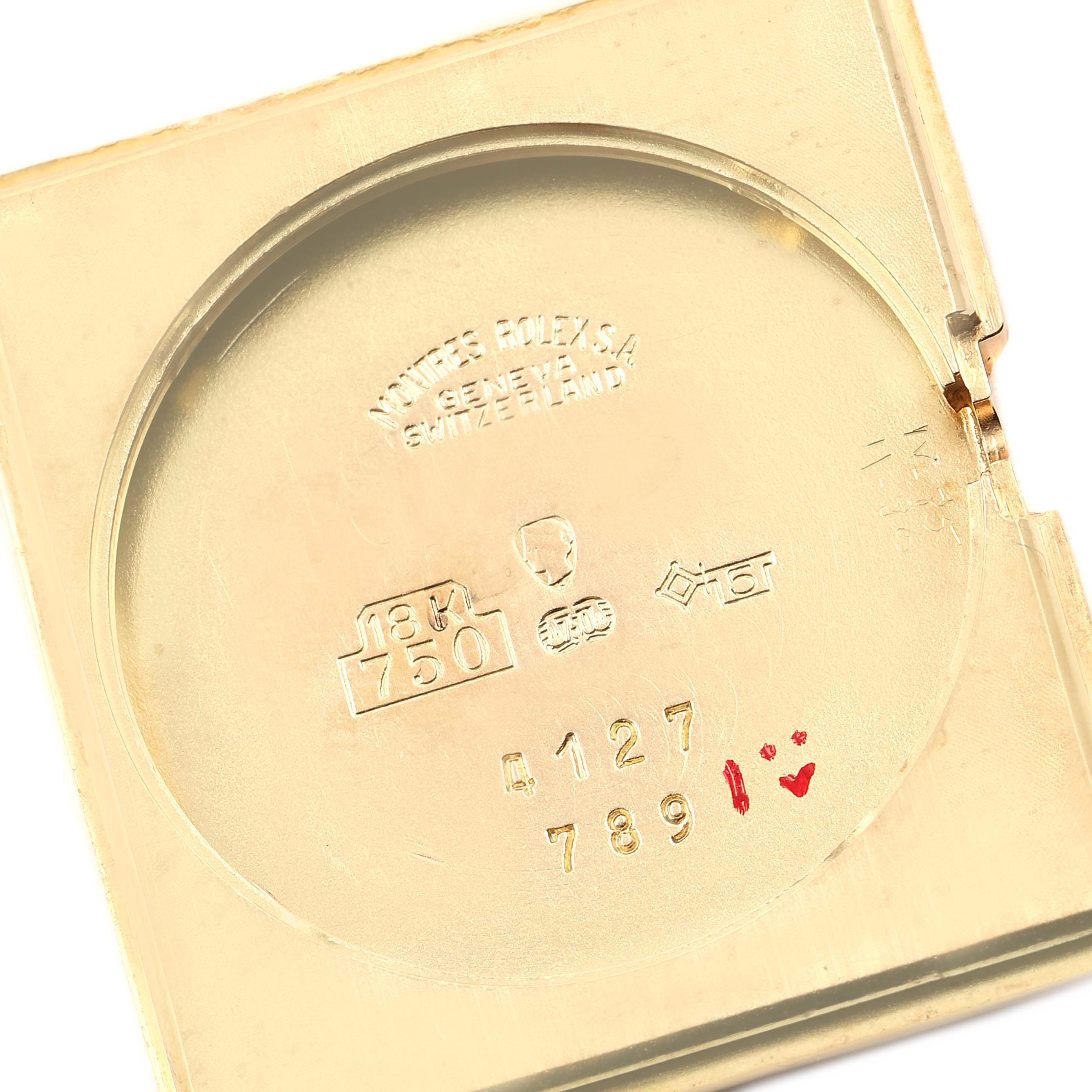 This image shows the inner case back of a Rolex Cellini 4127 Men's Yellow Gold Brown Dial 4127 Men's Yellow Gold Brown Dial model, featuring engravings and hallmarks, including "18K 750."