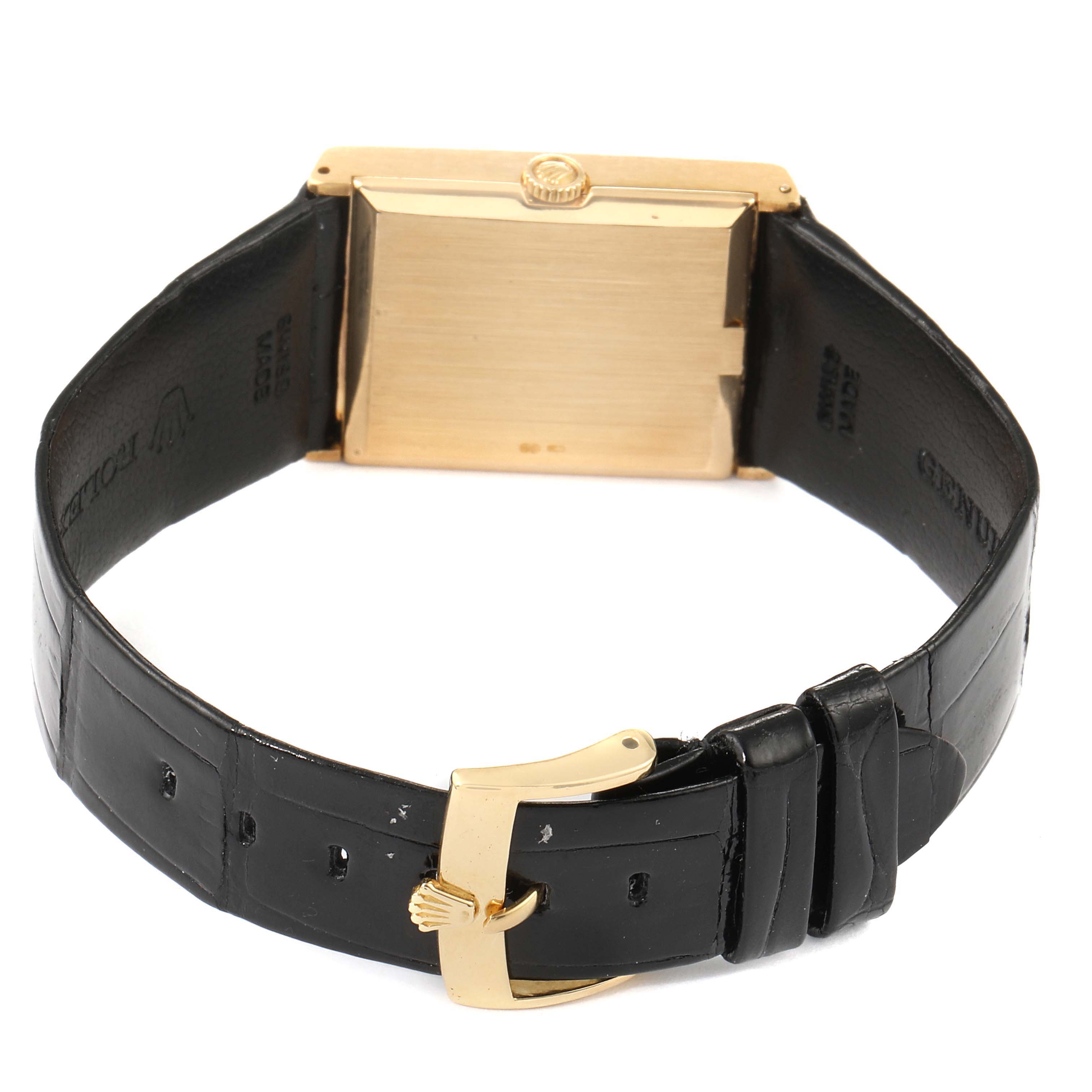 The image shows the back view of a Rolex Cellini 4127 Men's Yellow Gold Brown Dial 4127 Men's Yellow Gold Brown Dial watch with a gold case and black leather strap.