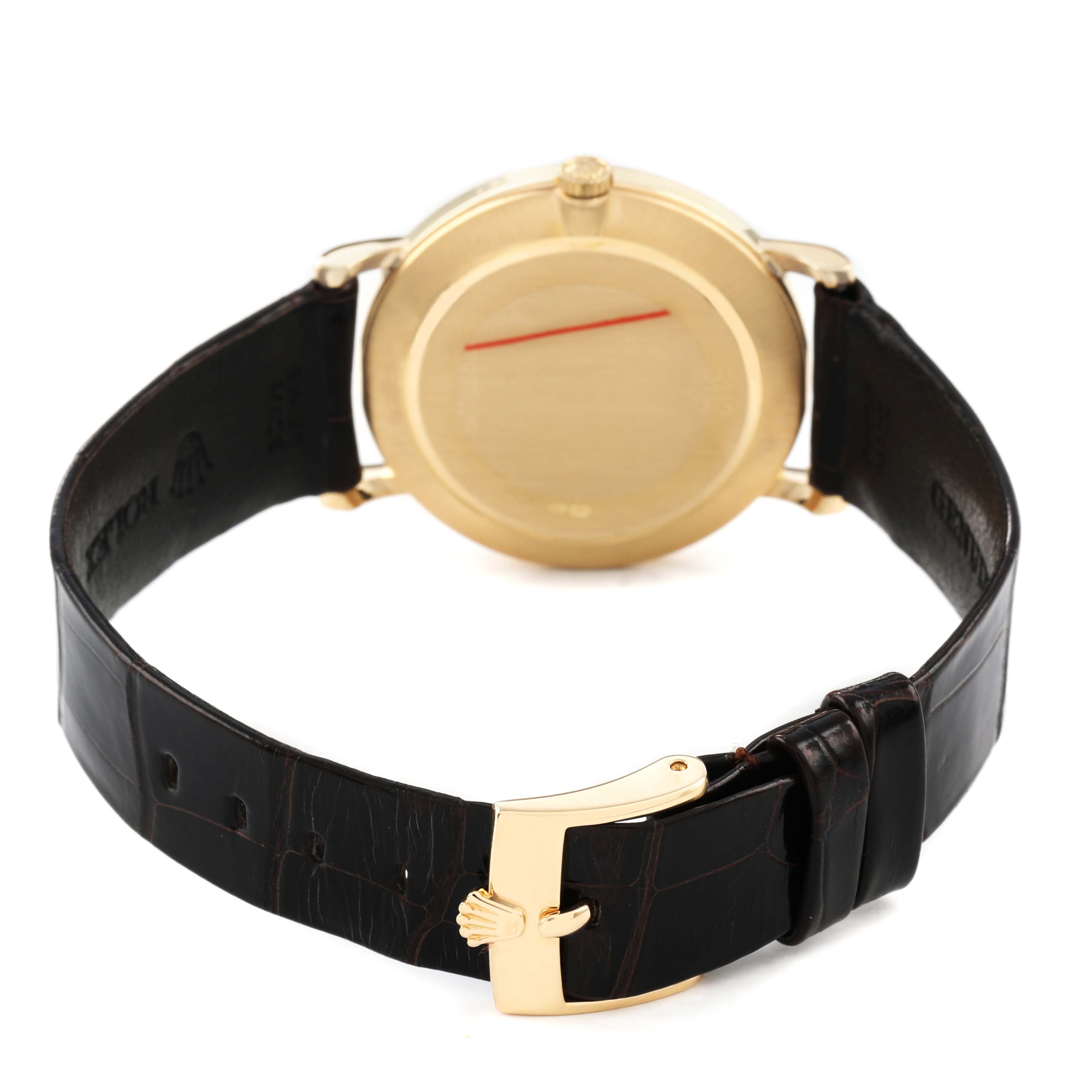 The Rolex Cellini 5112 Men's Yellow Gold White Dial watch is shown from the back, highlighting the clasp, leather strap, and case back.