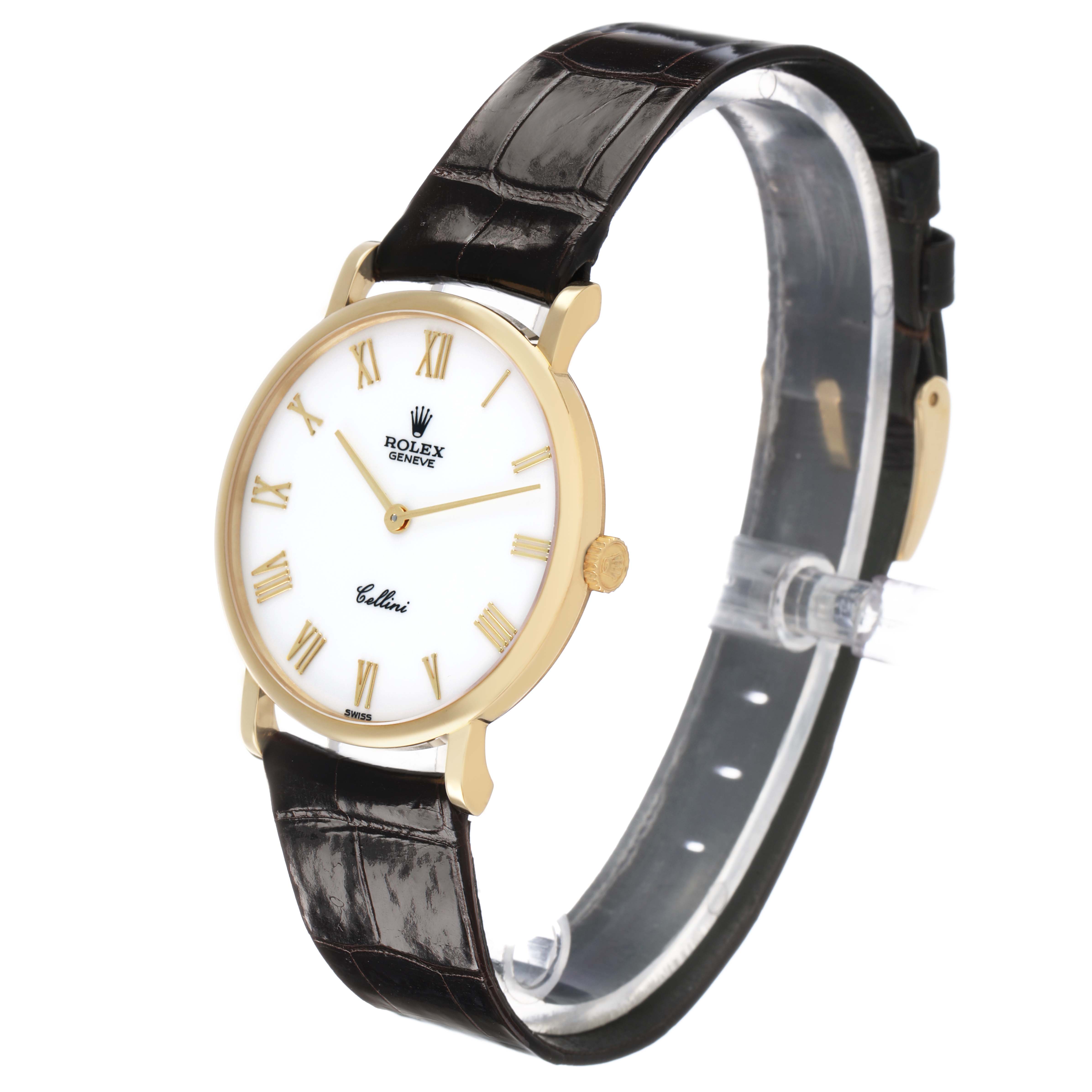 The Rolex Cellini 5112 Men's Yellow Gold White Dial watch is shown at a three-quarter angle, highlighting its gold case, white dial with Roman numerals, and leather strap.
