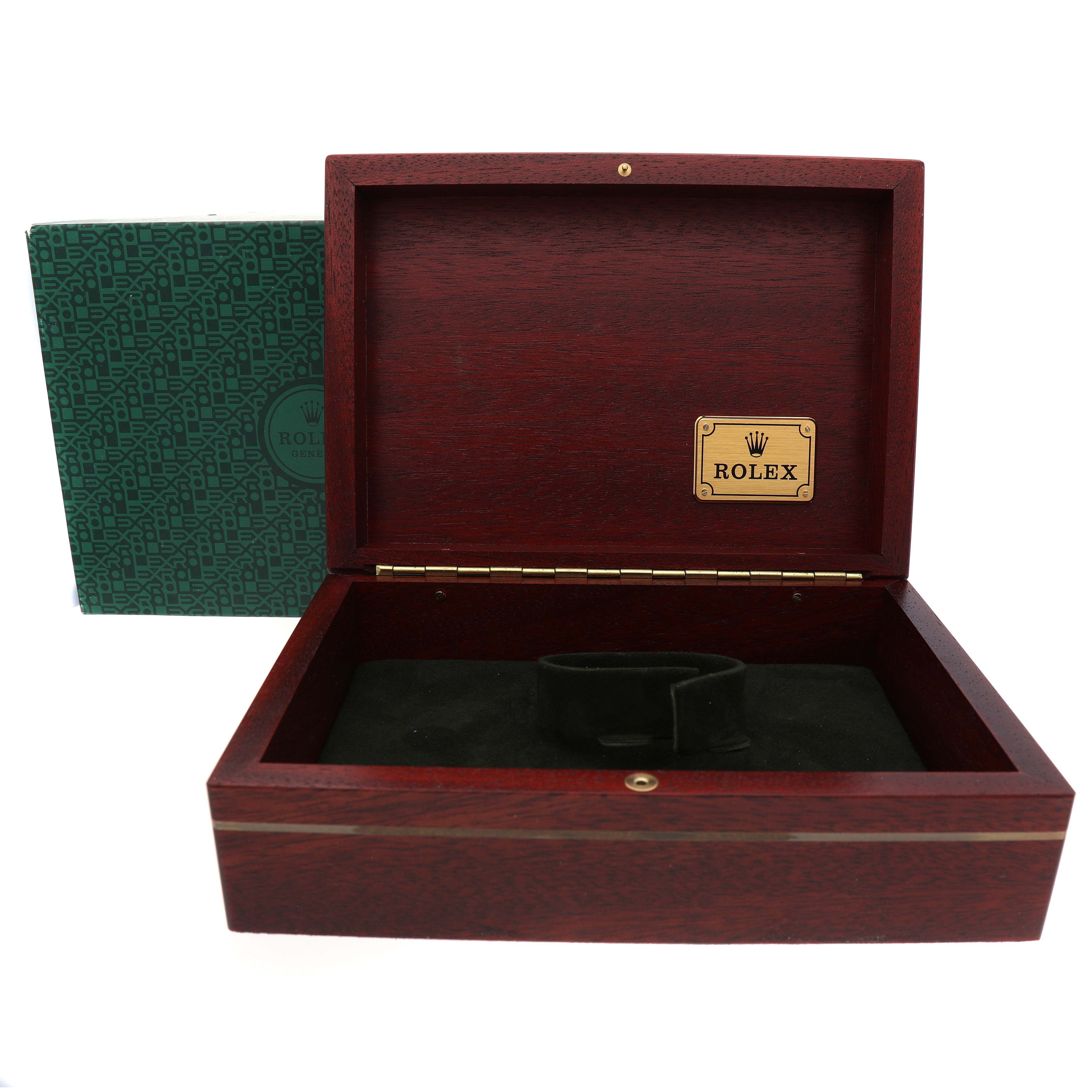 The image shows an open Rolex Daytona 116518 Men's Yellow Gold Blue Dial watch box, highlighting the interior, with a logo plaque inside the lid.