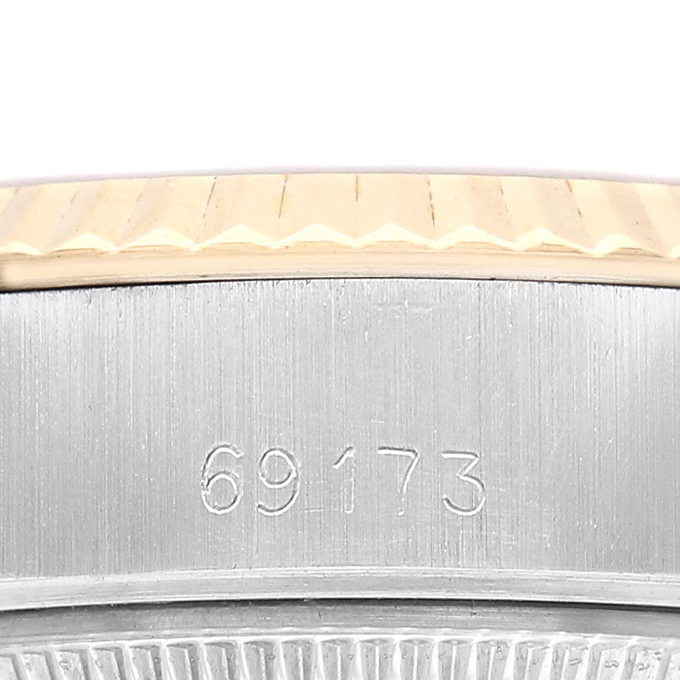 The image shows a close-up of the case side and bezel of a Rolex Datejust 69173 Women's Steel and Gold (two tone) Champagne Dial, highlighting the reference number.