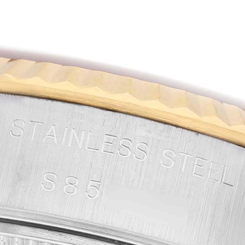 The image shows a close-up of the stainless steel case back and gold bezel of a Rolex Datejust 69173 Women's Steel and Gold (two tone) Champagne Dial.
