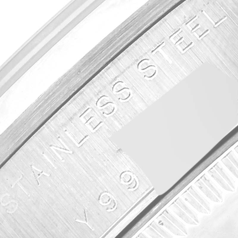 This image shows a close-up of the engraving on the stainless steel case of a Mid-Size Rolex watch.