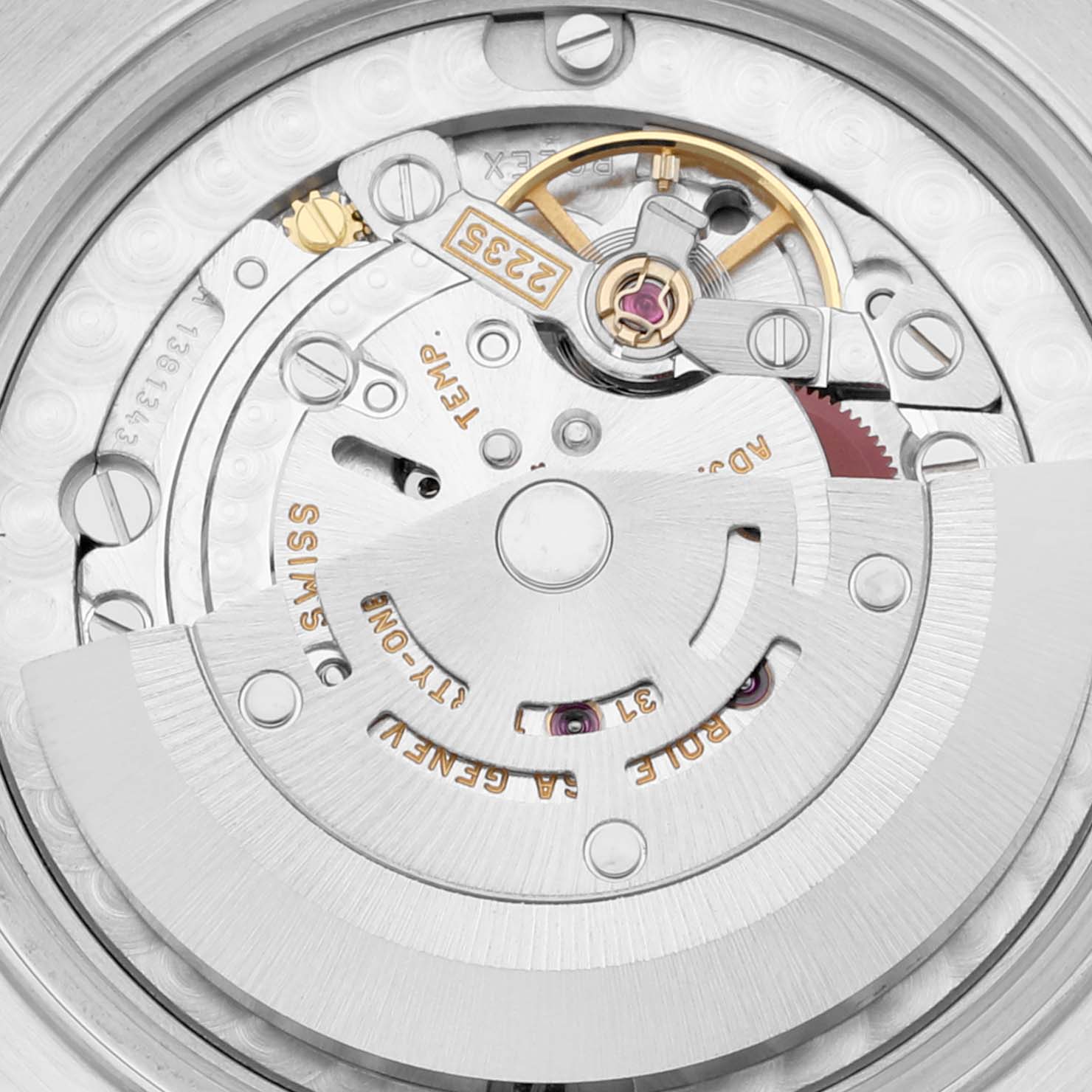 This image shows the movement and internal mechanism of a Mid-Size Rolex watch, viewed from the back.