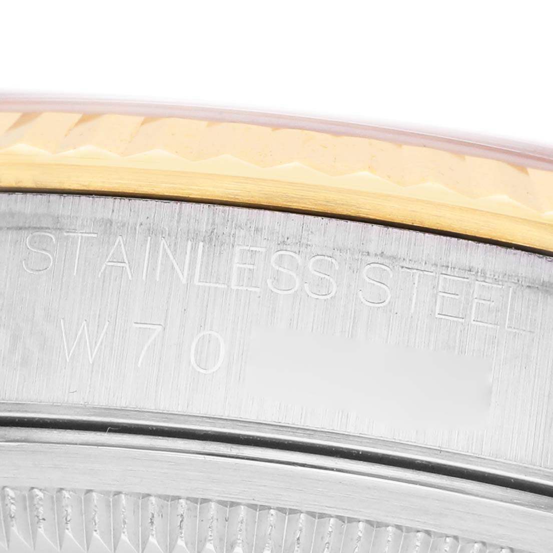 The image shows a close-up of the case back edge and part of the fluted bezel of a Rolex Datejust 41 16233 Men's Steel and Gold (two tone) Beige Dial.