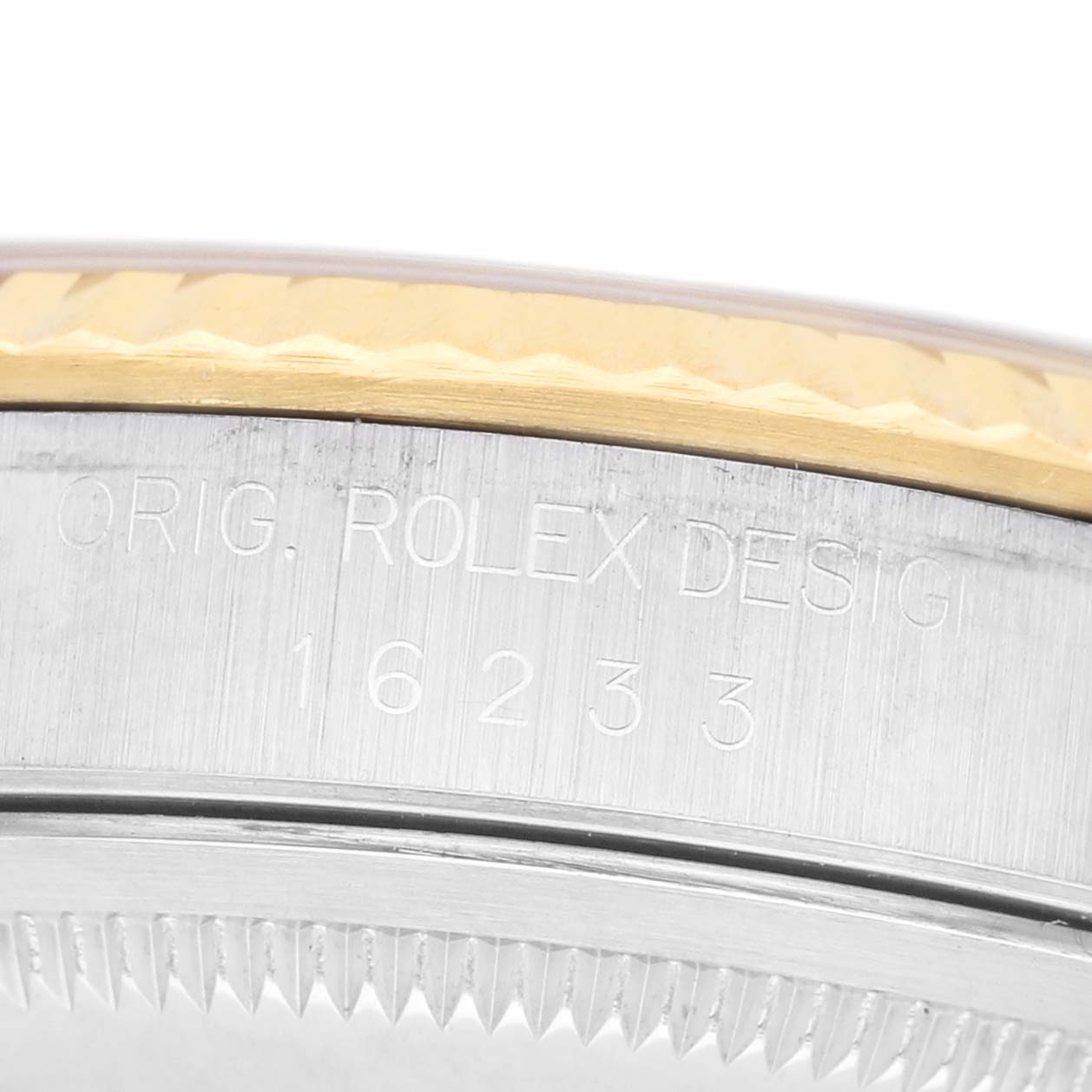 The image shows a close-up of the side engraving and bezel of a Rolex Datejust 41 16233 Men's Steel and Gold (two tone) Beige Dial watch.