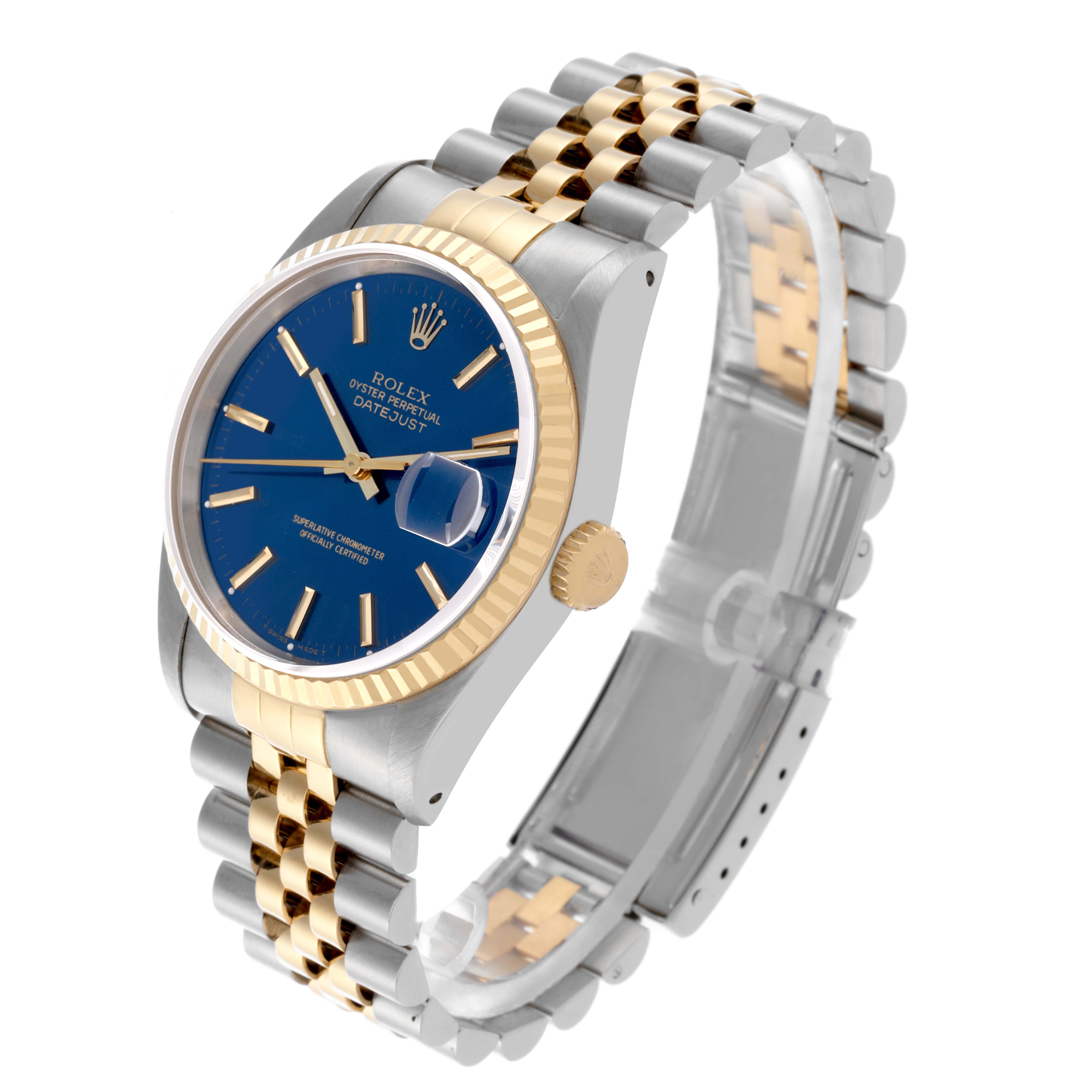 This Rolex Datejust 16233 Men's Steel and Gold (two tone) Blue Dial 16233 Men's Steel and Gold (two tone) Blue Dial watch is shown at an angled side view, displaying the face, two-tone bracelet, and fluted bezel.