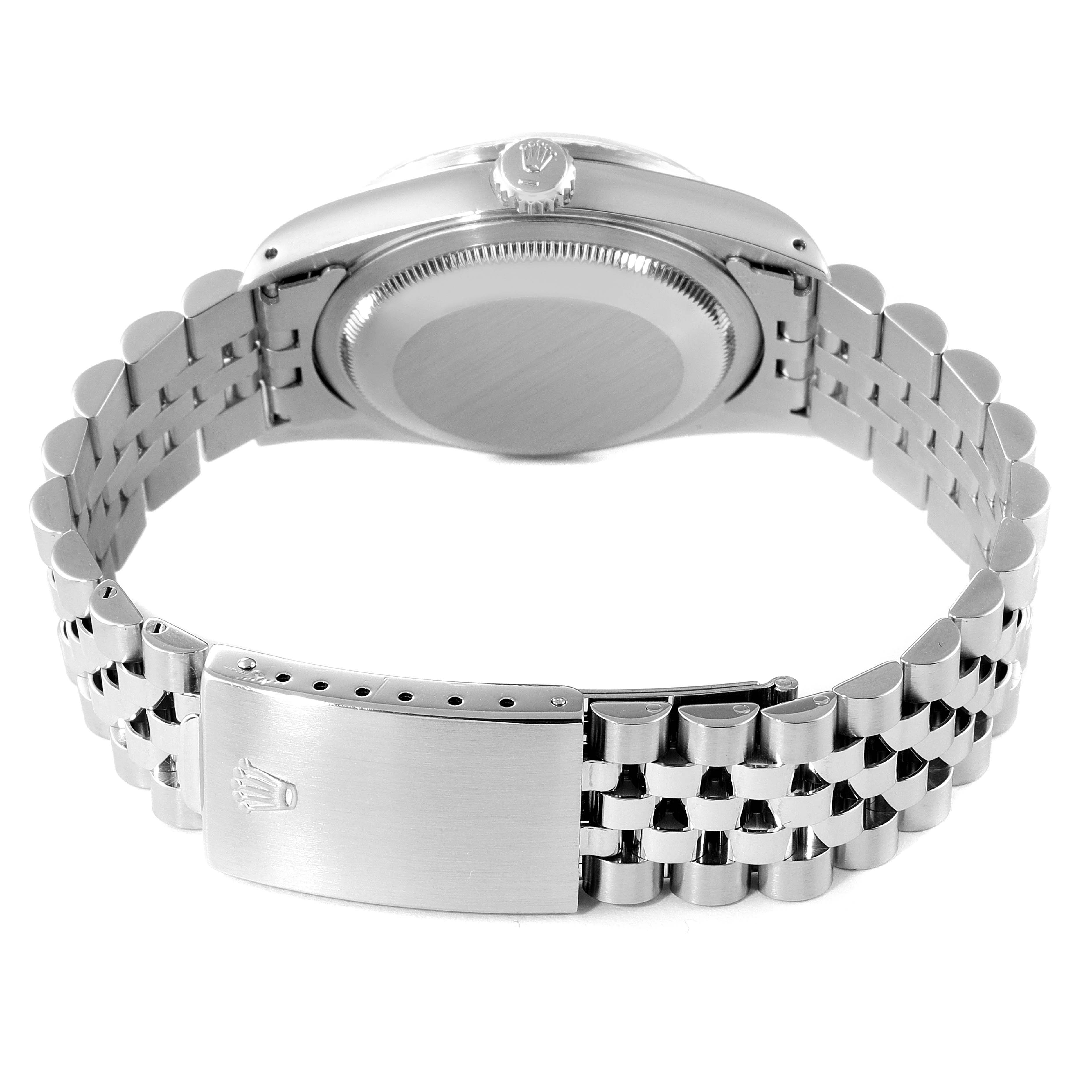 The image shows the back view of a Rolex Datejust 16220 Men
s Stainless Steel Black Dial 16220 Men
s Stainless Steel Black Dial watch, highlighting the bracelet clasp and case back.