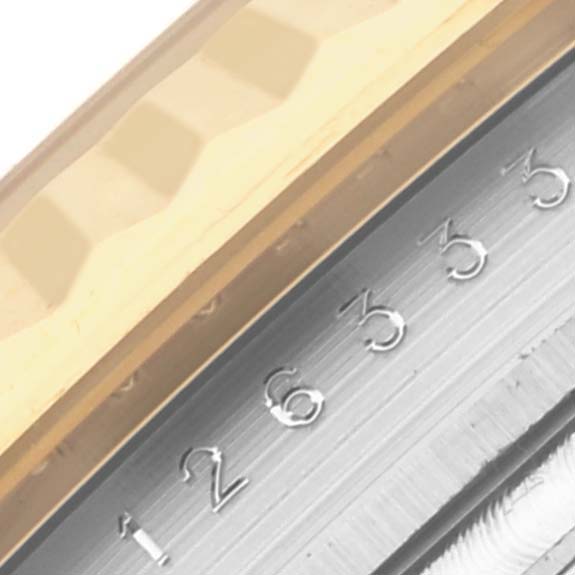 The image shows a close-up of the fluted bezel and the edge of the dial with numbered markings on a Rolex Datejust 41 126333 Men's Steel and Gold (two tone) Grey Dial 126333 Men's Steel and Gold (two tone) Grey Dial.
