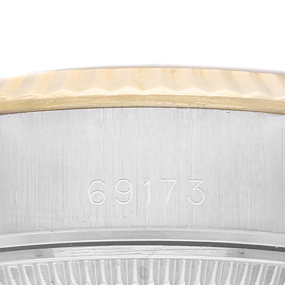 This close-up image shows the model number and part of the bezel of a Rolex Datejust 69173 Women's Steel and Gold (two tone) Champagne Dial 69173 Women's Steel and Gold (two tone) Champagne Dial watch.