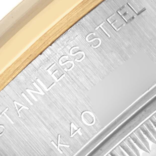 The image shows a close-up of the Rolex Datejust 79163 Women's Steel and Gold (two tone) White Dial 79163 Women's Steel and Gold (two tone) White Dial's case back edge, highlighting the "Stainless Steel" marking.