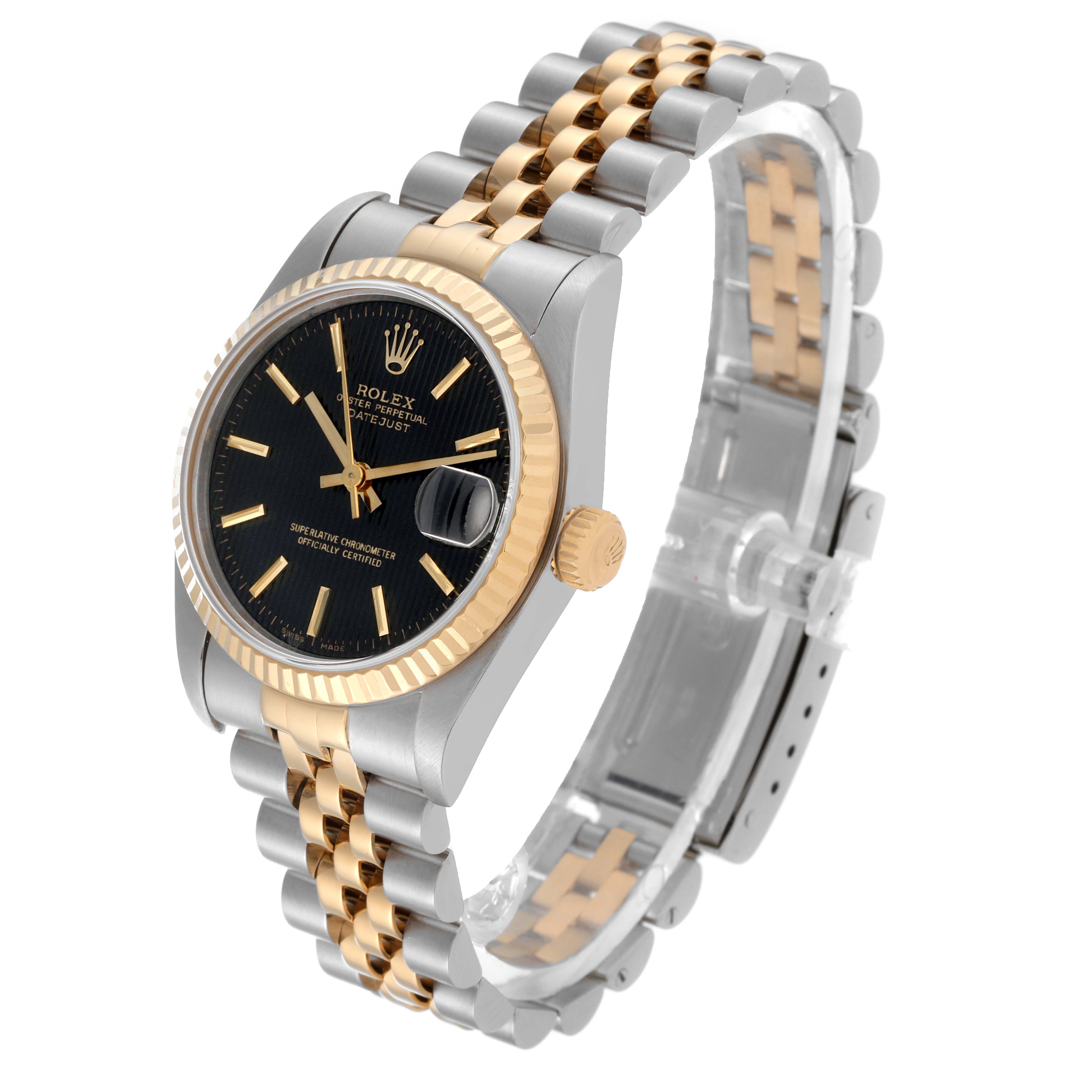 The image shows a side and top view of a Mid-Size Rolex watch with a gold and silver bracelet and black dial.