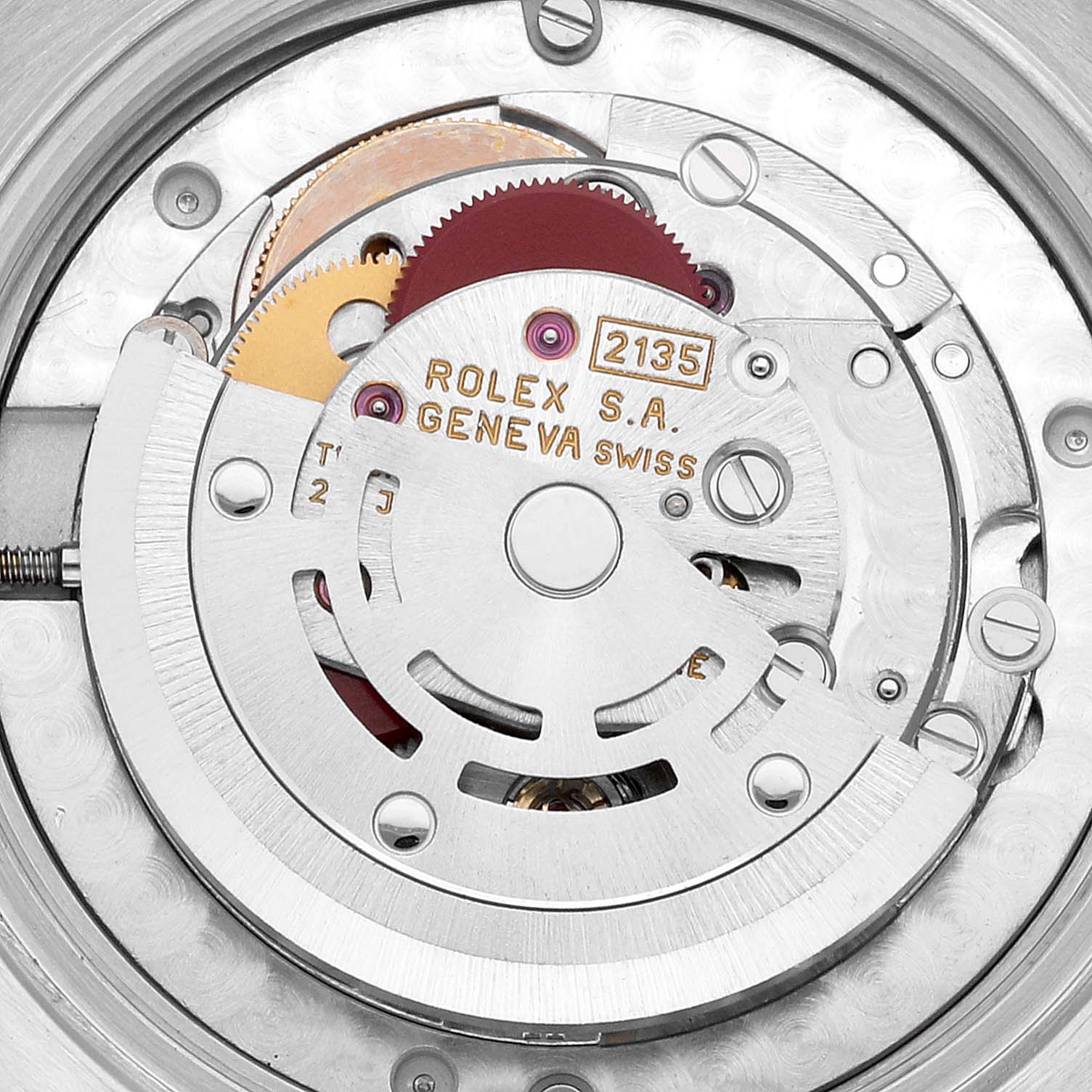 This image shows the interior mechanical movement of a Mid-Size Rolex watch, focusing on the rotor and gear mechanism.