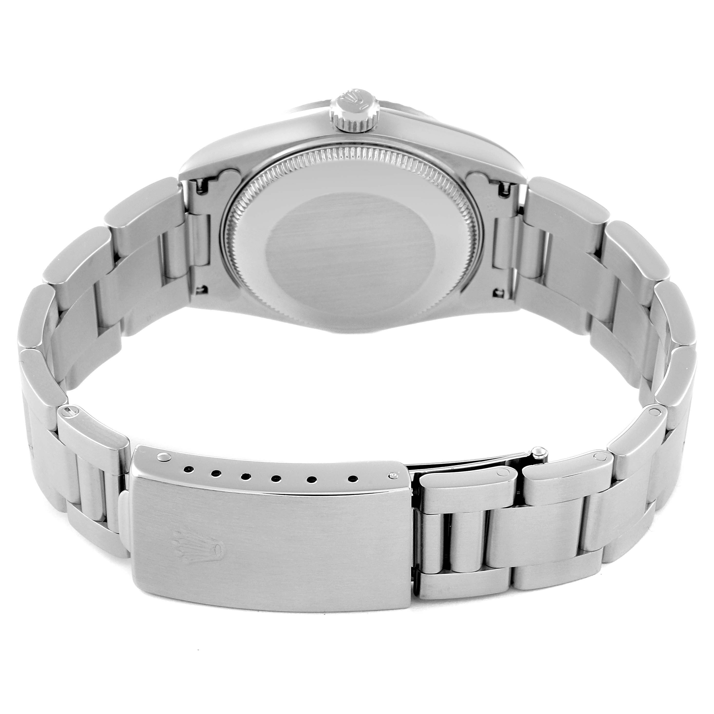 This image shows the back case and bracelet clasp of a Mid-Size Rolex watch from a rear angle.