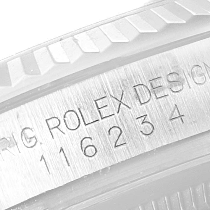 The image shows a close-up of the model number and "ROLEX DESIGN" engraving on the case of a Rolex Datejust 116234 Men's Stainless Steel Mother of Pearl Dial 116234 Men's Stainless Steel Mother of Pearl Dial watch.