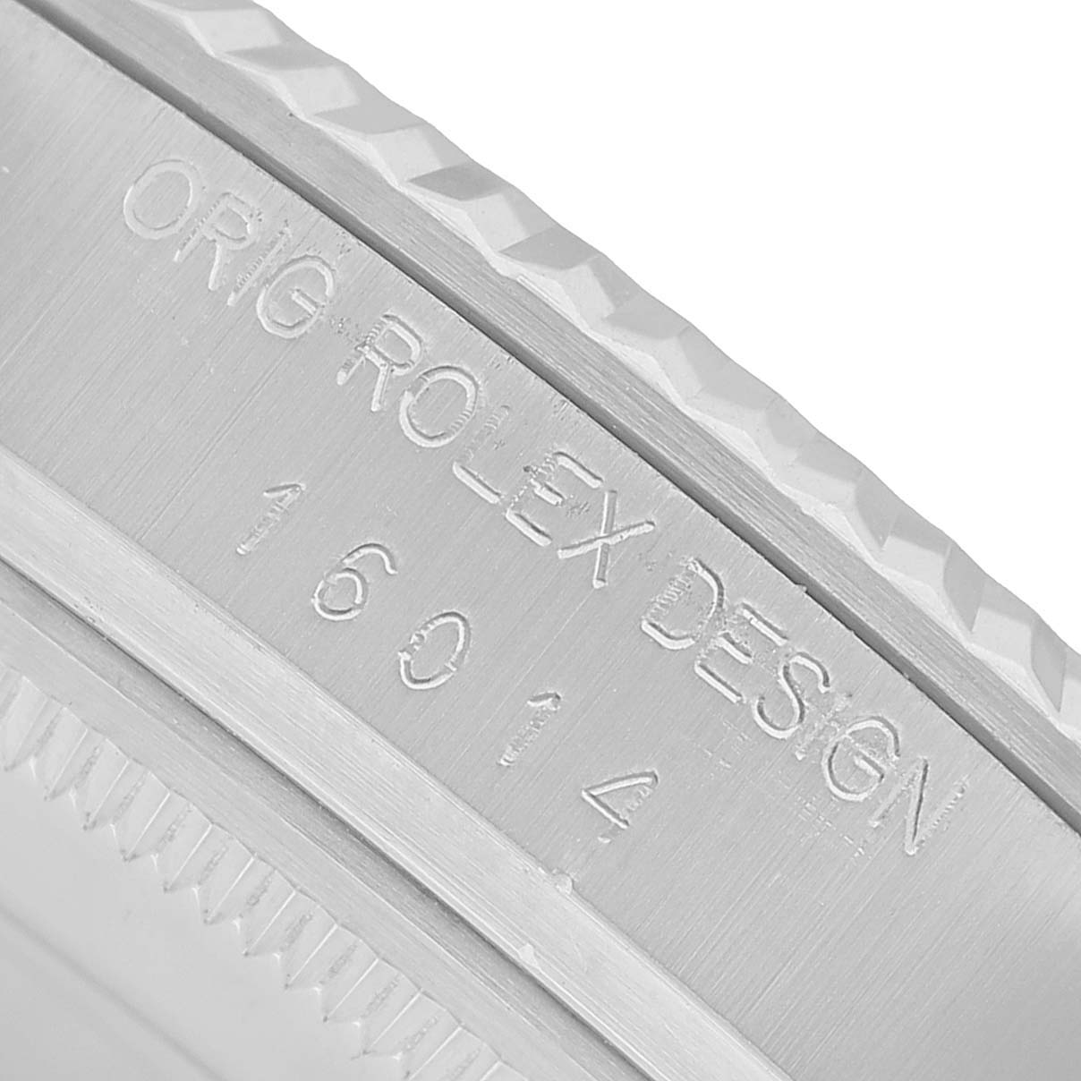 The image shows a close-up of the side of a Rolex Datejust 16014 Men's Stainless Steel Silver Dial, focusing on its engraved edge and design details.