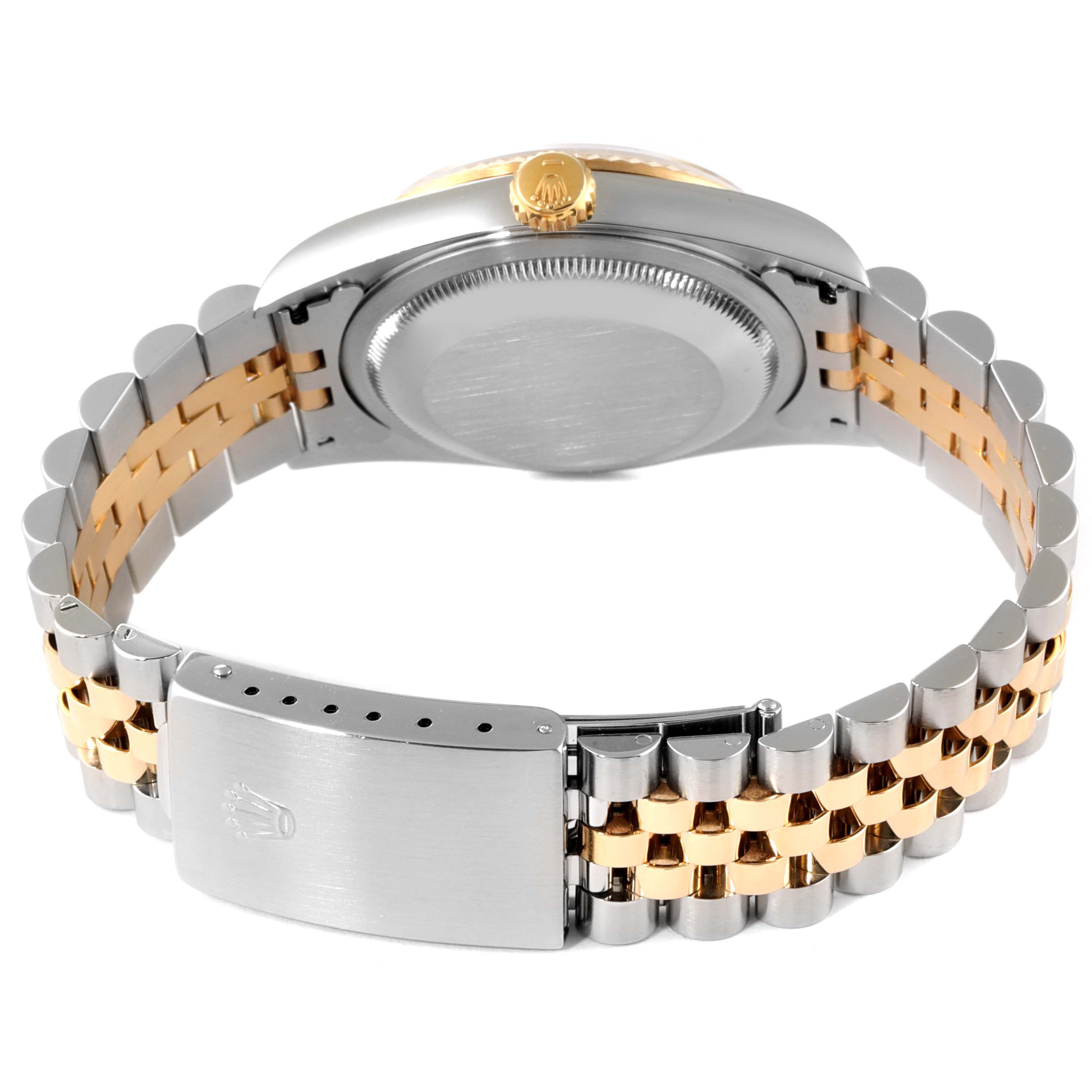 The image shows the back view of a Rolex Datejust 16233 Men's Steel and Gold (two tone) Champagne Dial 16233 Men's Steel and Gold (two tone) Champagne Dial watch, highlighting its case back, crown, and two-tone bracelet with clasp.