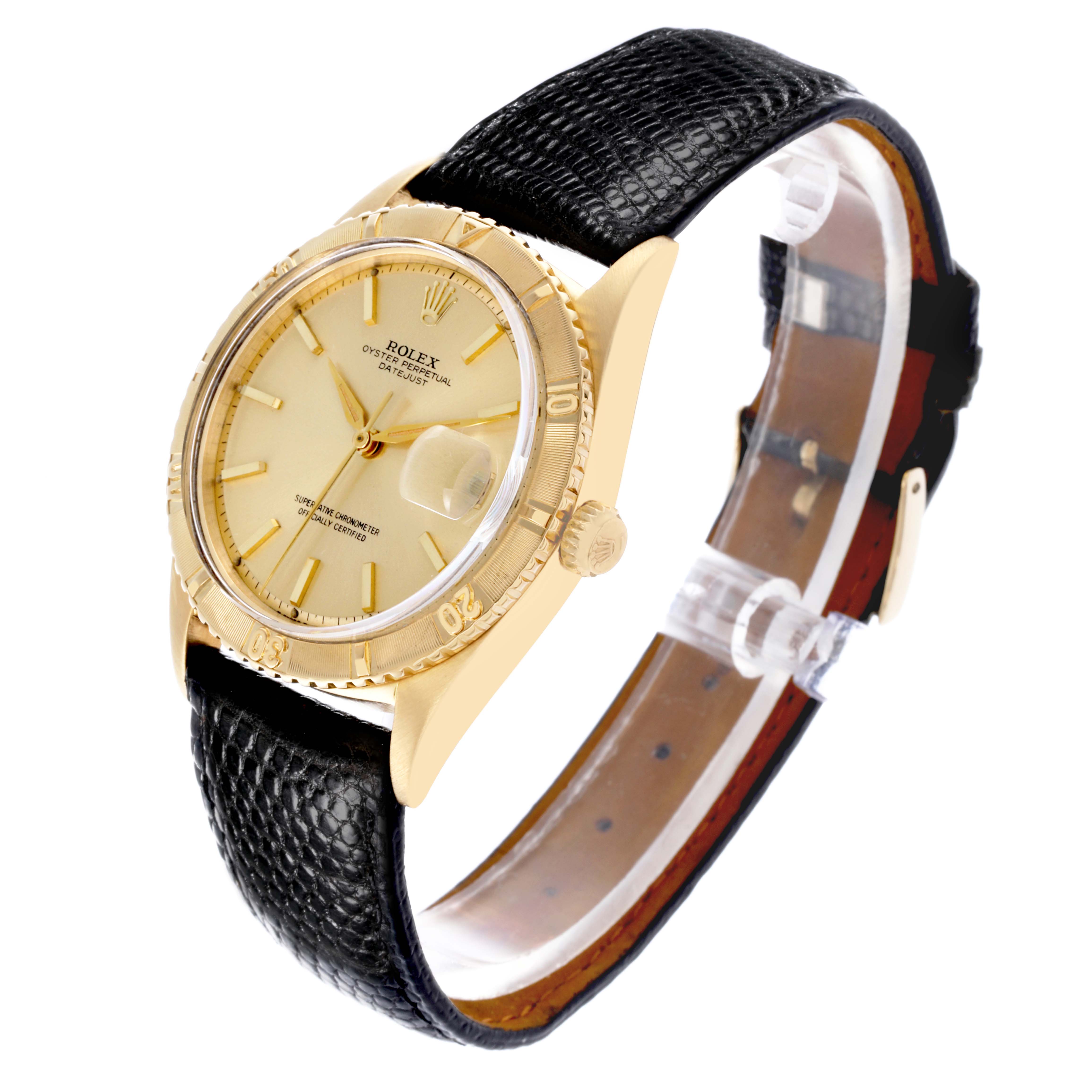 The Rolex Turn-o-Graph is shown from a three-quarter angle, displaying the face, bezel, crown, and black leather strap.