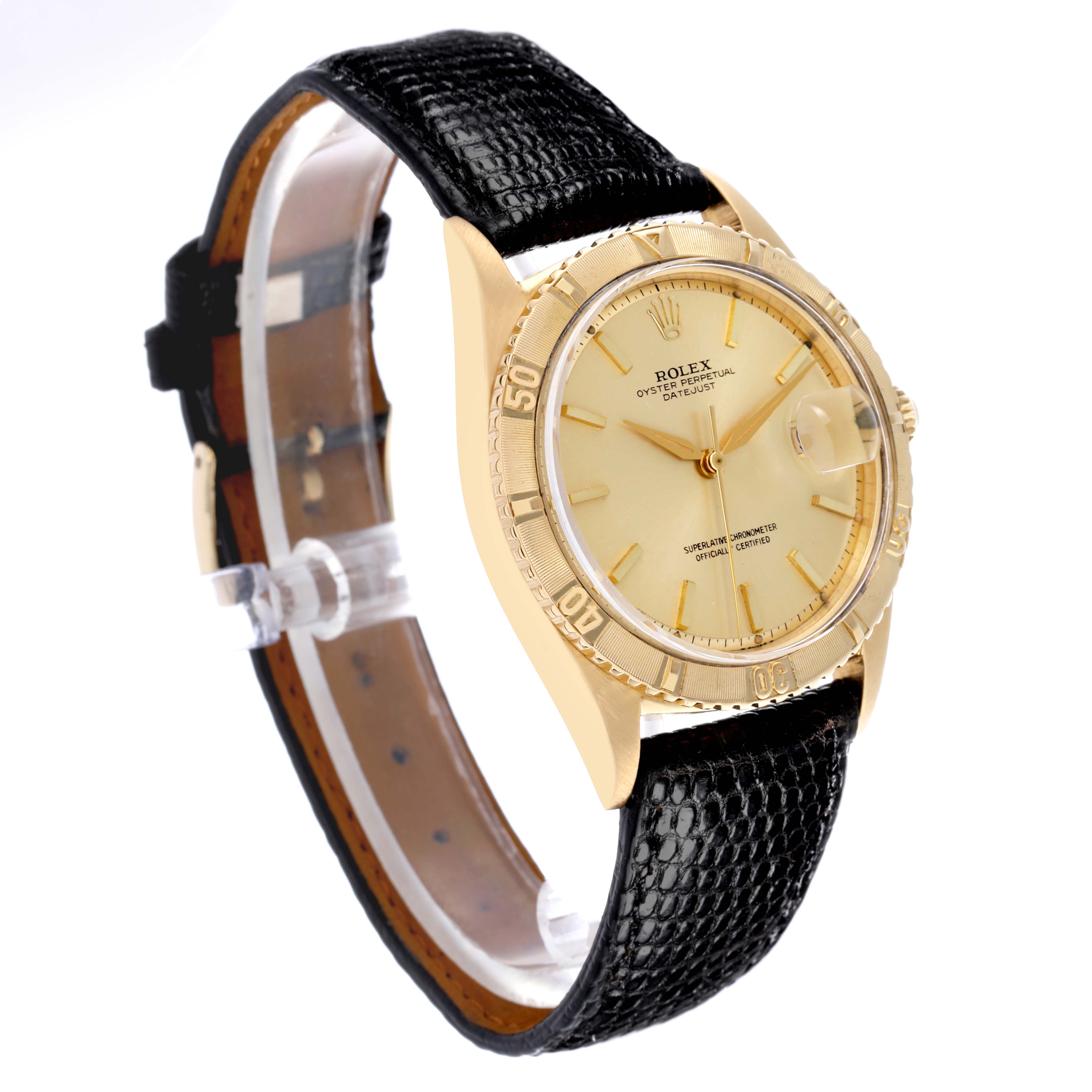 The image shows a Rolex Turn-o-Graph watch at a three-quarter angle, highlighting the face, bezel, and black strap.