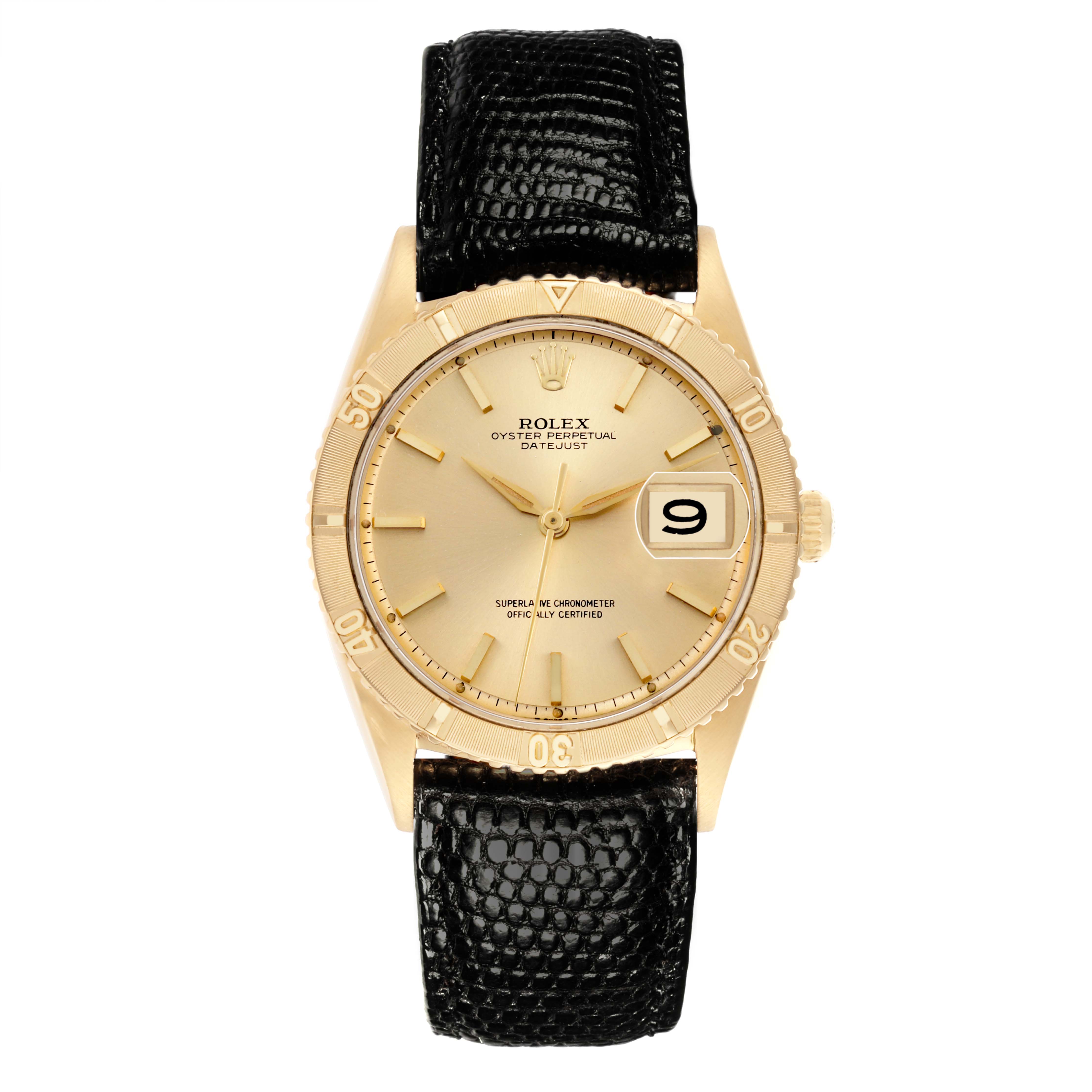 The Rolex Turn-o-Graph watch is shown from a top-down angle, displaying the face, bezel, and black leather strap.