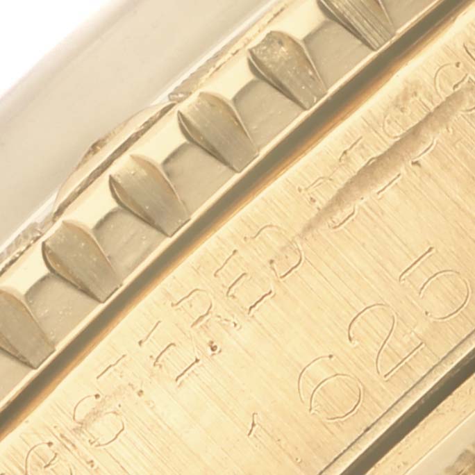 The image shows a close-up of the bezel's edge and engraved numbers on the Rolex Turn-o-Graph.
