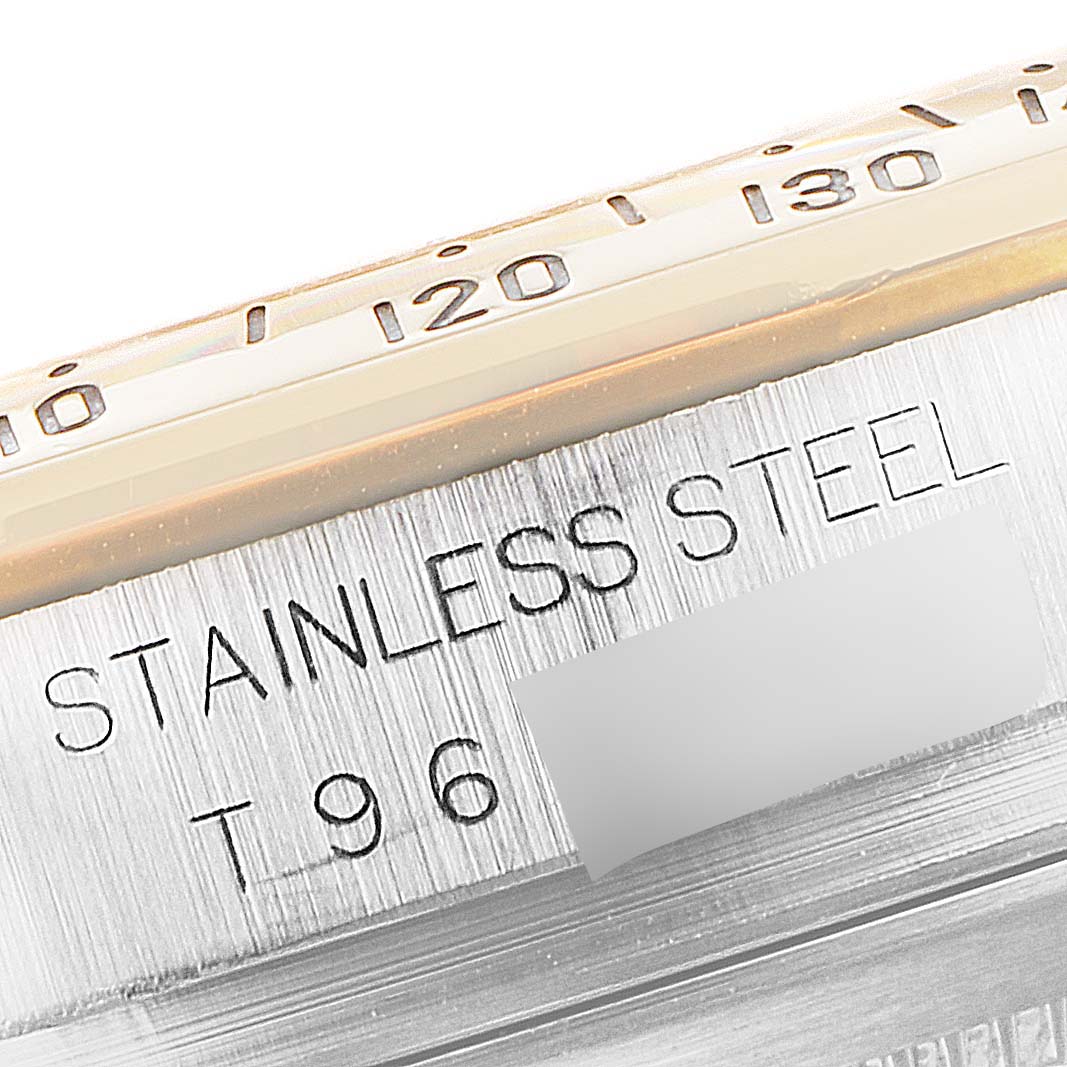 This image shows a close-up of the stainless steel casing and engraved text on a Rolex Daytona 16523 Men's Steel and Gold (two tone) White Dial 16523 Men's Steel and Gold (two tone) White Dial watch.