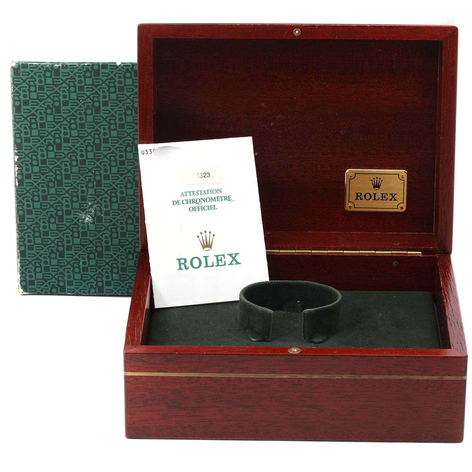 The image shows an open wooden Rolex Daytona 16523 Men
s Steel and Gold (two tone) White Dial 16523 Men
s Steel and Gold (two tone) White Dial watch box with a green inner cushion and an official warranty booklet.