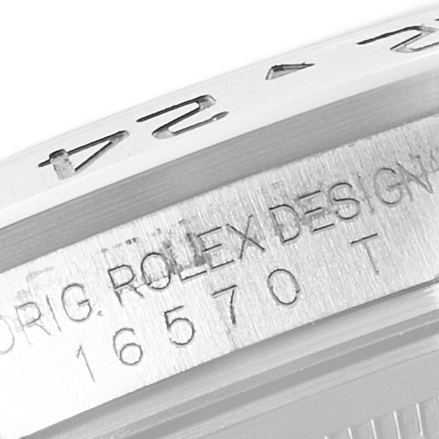 The image shows a close-up of the bezel and case markings of a Rolex Explorer 16570 Men's Stainless Steel White Dial 16570 Men's Stainless Steel White Dial model 16570 watch.