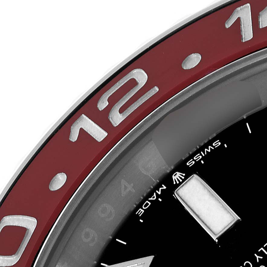 This is a close-up view of the bezel and part of the dial of a Rolex GMT-Master 126710BLRO Men's Stainless Steel Black Dial 126710BLRO Men's Stainless Steel Black Dial watch.