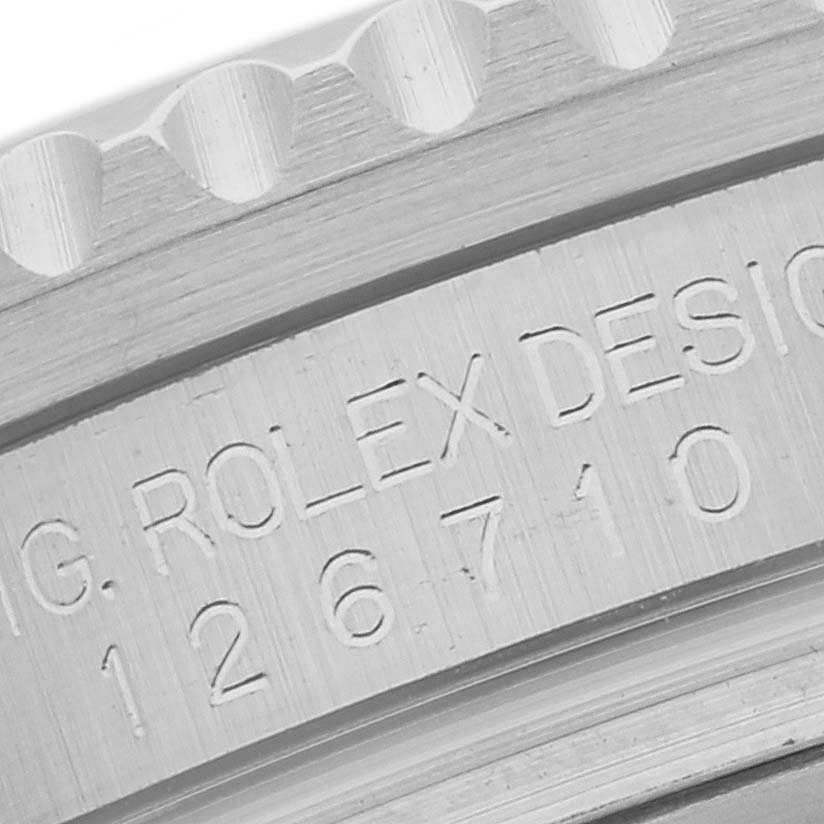 Close-up image of the engraved model number and branding on the case of a Rolex GMT-Master 126710BLRO Men's Stainless Steel Black Dial 126710BLRO Men's Stainless Steel Black Dial watch.