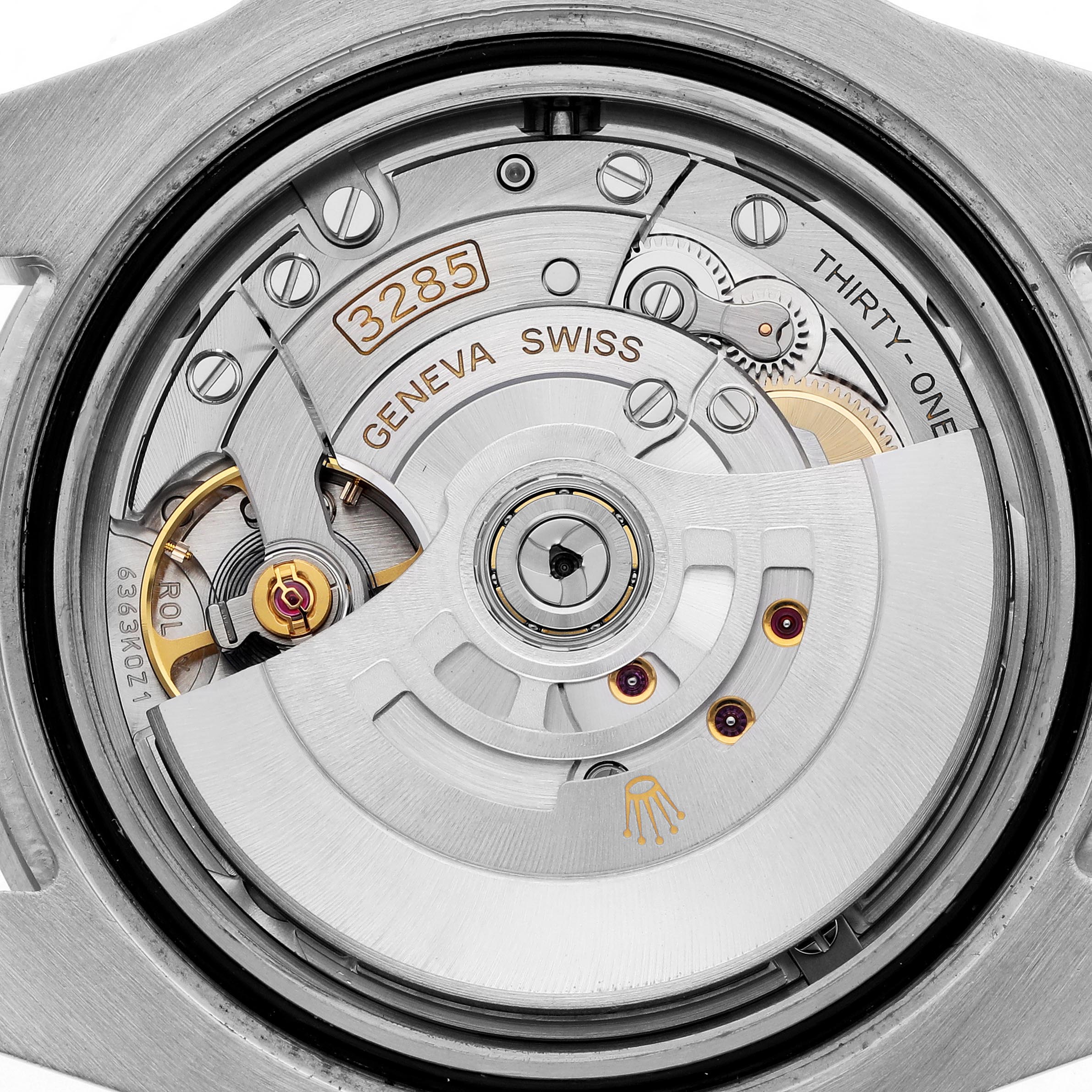 The image shows the movement of a Rolex GMT-Master 126710BLRO Men's Stainless Steel Black Dial 126710BLRO Men's Stainless Steel Black Dial, highlighting the rotor, gears, and "3285" engraving from the back.