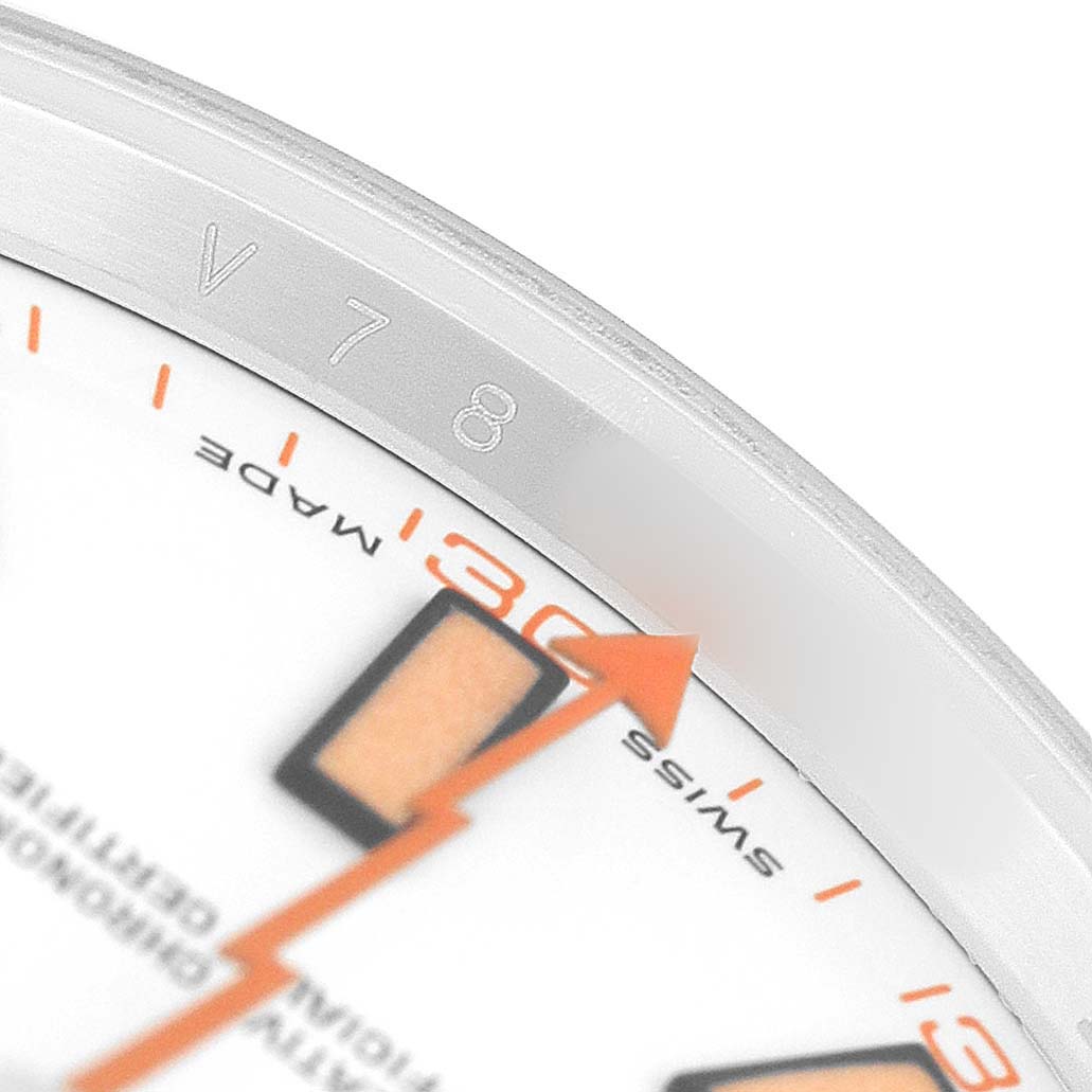 The image shows a close-up of the Rolex Milgauss 116400 Men's Stainless Steel White Dial watch face, highlighting the orange lightning bolt second hand and partial numbering.