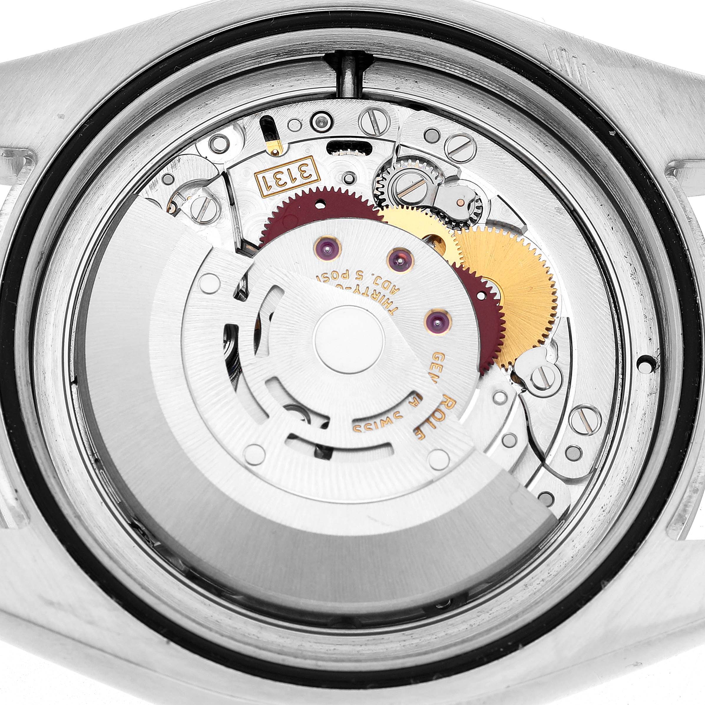 The image shows the internal movement mechanism from the back of the Rolex Milgauss 116400 Men's Stainless Steel White Dial watch.