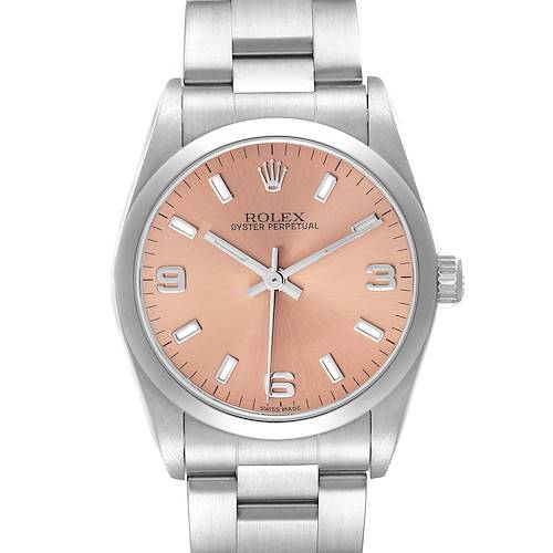 The Rolex Oyster Perpetual Mid-Size watch is shown from a top-down angle, displaying the dial, bezel, and part of the bracelet.