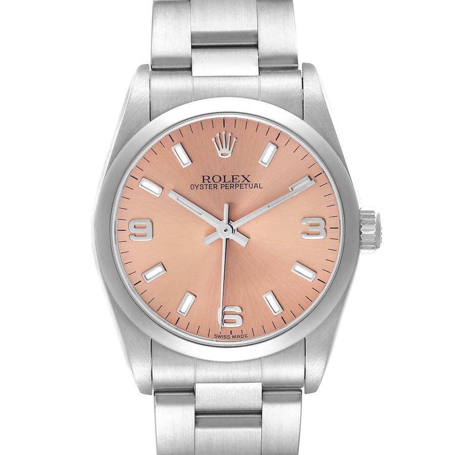 The Rolex Oyster Perpetual Mid-Size watch is shown from a front angle, highlighting the dial, bezel, and bracelet.