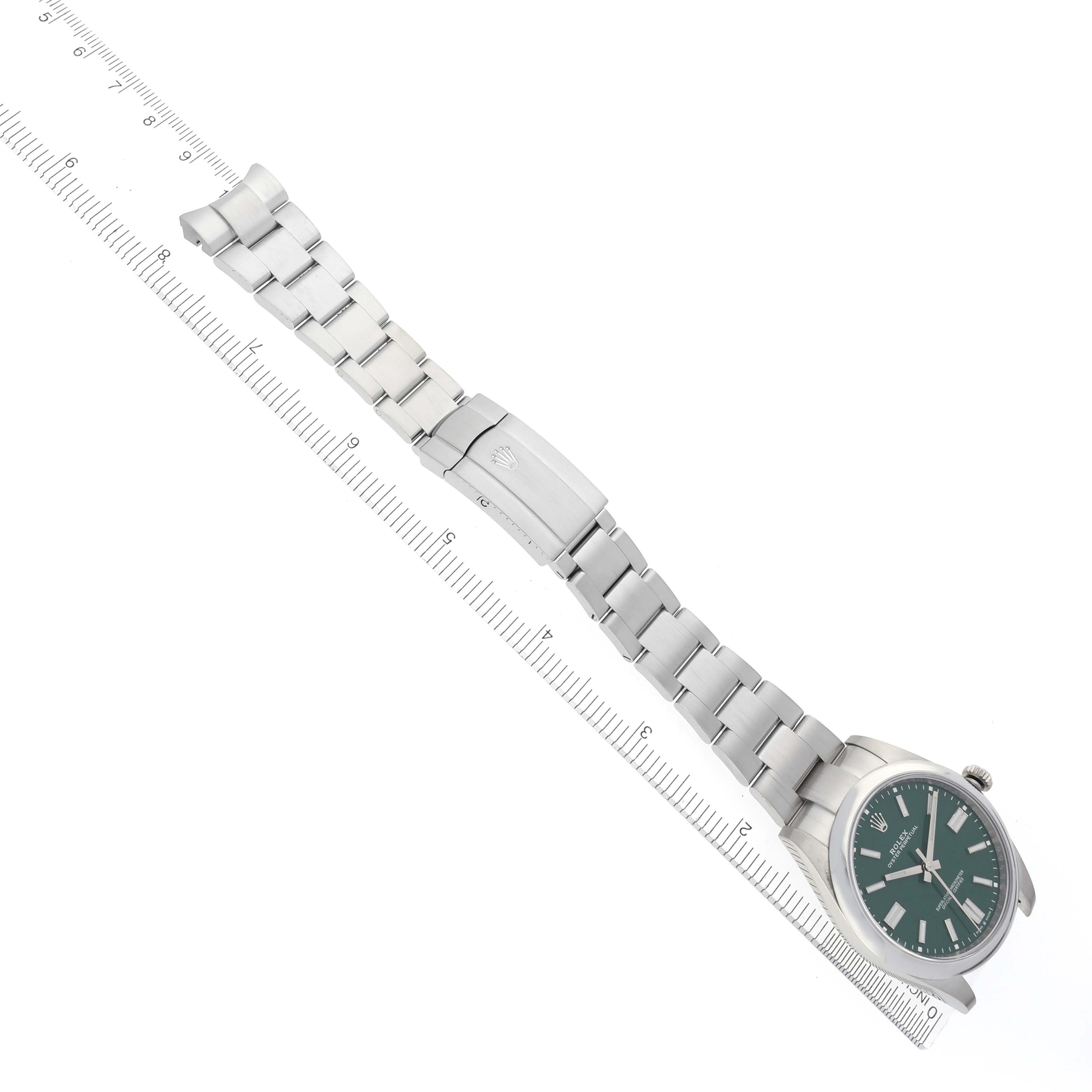 The Rolex Oyster Perpetual 124300 Men's Stainless Steel Green Dial 124300 Men's Stainless Steel Green Dial watch is shown at a slight angle, displaying the bracelet, clasp, and green dial.
