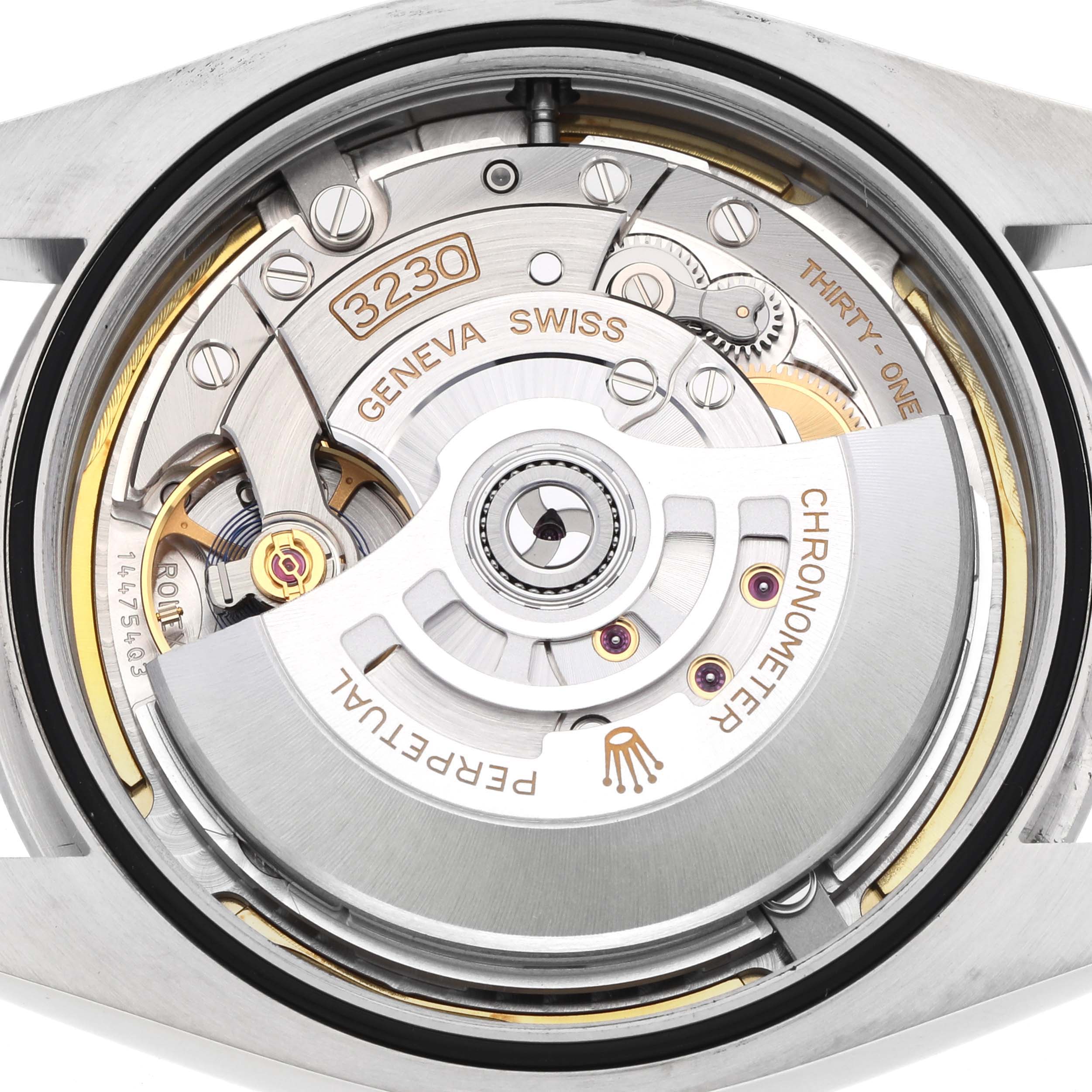 The image shows the back view of a Rolex Oyster Perpetual 124300 Men's Stainless Steel Green Dial 124300 Men's Stainless Steel Green Dial, displaying its intricate movement components.