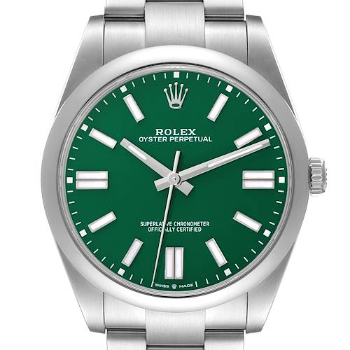 The Rolex Oyster Perpetual watch is shown from a top-down angle, displaying the green dial and the stainless steel bracelet.