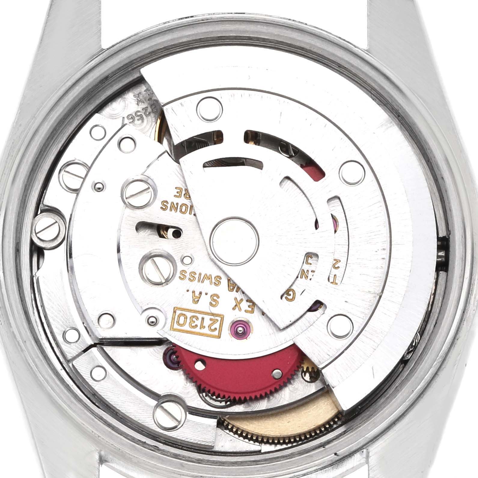 The image shows the movement from the back of a Rolex Oyster Perpetual 67194 Women's Stainless Steel Blue Dial 67194 Women's Stainless Steel Blue Dial, revealing its intricate mechanical parts.