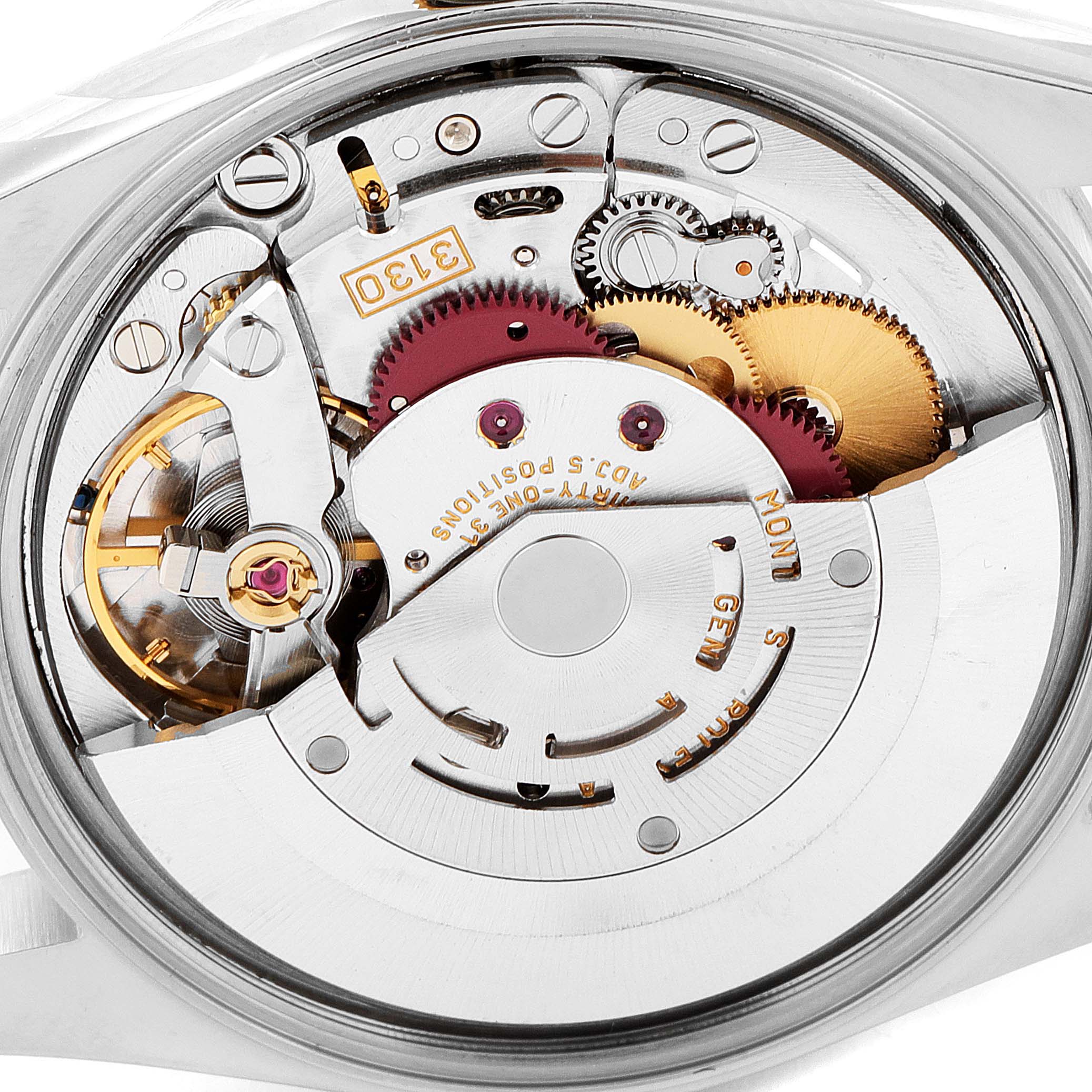 This image shows a close-up view of the movement mechanism inside a Rolex Oyster Perpetual 14203M Men's Steel and Gold (two tone) Grey Dial 14203M Men's Steel and Gold (two tone) Grey Dial watch.
