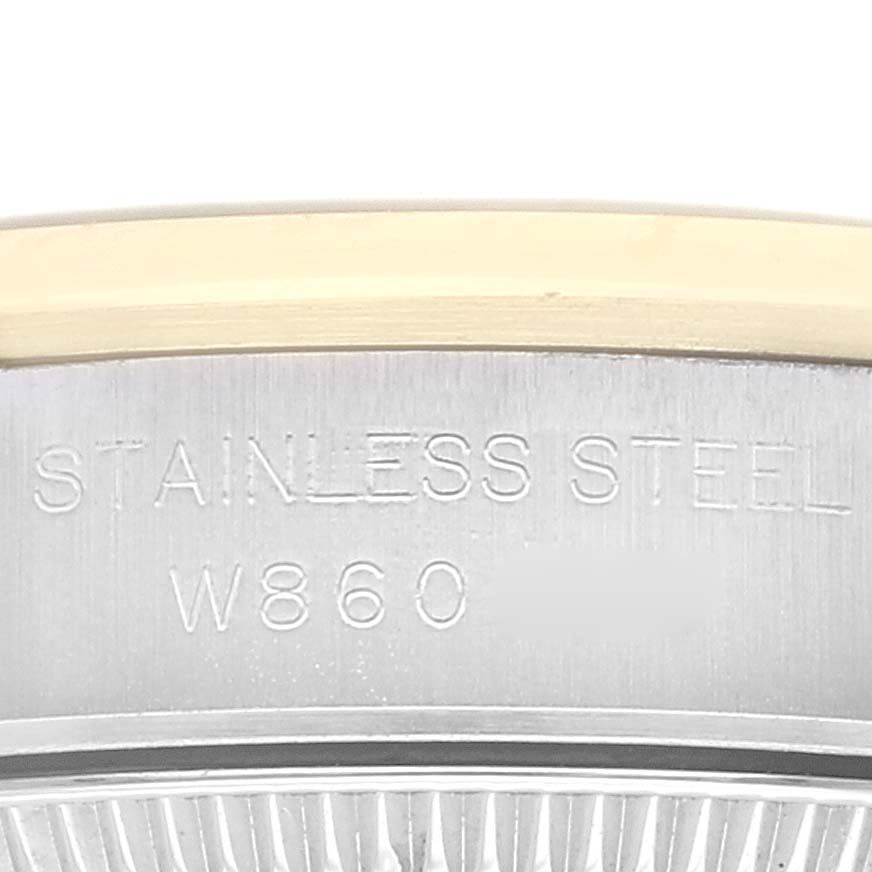 This image shows a close-up of the stainless steel casing side of a Rolex Oyster Perpetual 67183 Women's Steel and Gold (two tone) Grey Dial 67183 Women's Steel and Gold (two tone) Grey Dial model.
