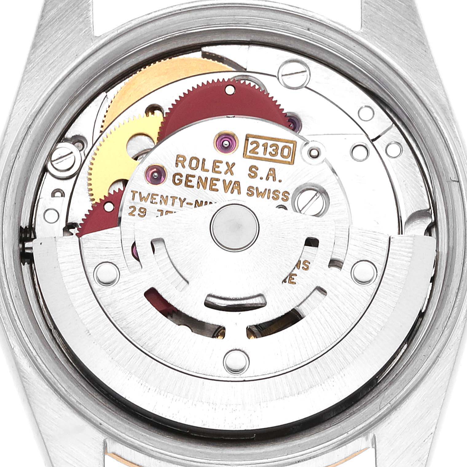 This is a close-up view of the movement mechanism of a Rolex Oyster Perpetual 67183 Women's Steel and Gold (two tone) Grey Dial 67183 Women's Steel and Gold (two tone) Grey Dial watch, showing internal components and engravings.