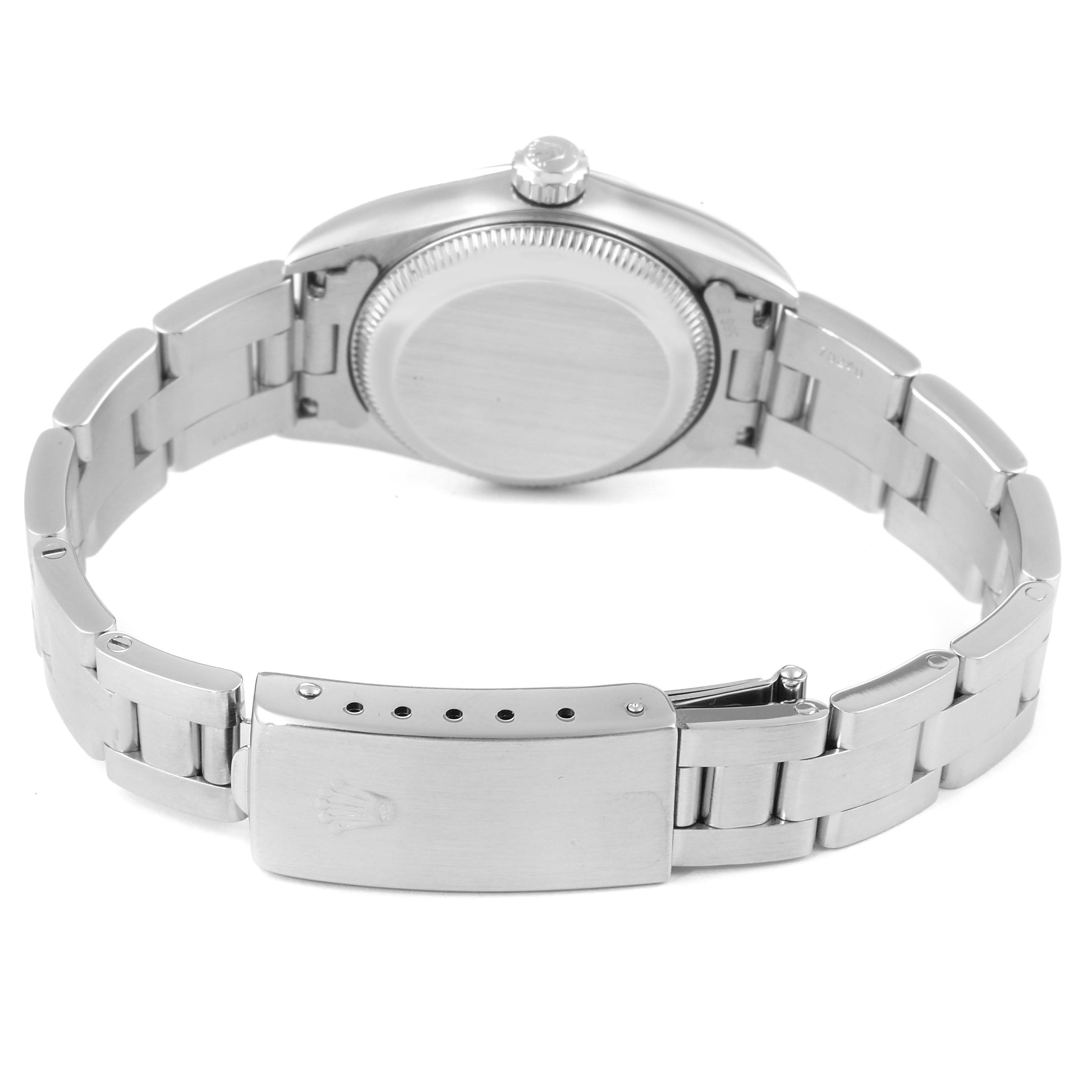 The image shows the back case and bracelet clasp of a Rolex Oyster Perpetual 76080 Women's Stainless Steel Pink Dial 76080 Women's Stainless Steel Pink Dial watch.