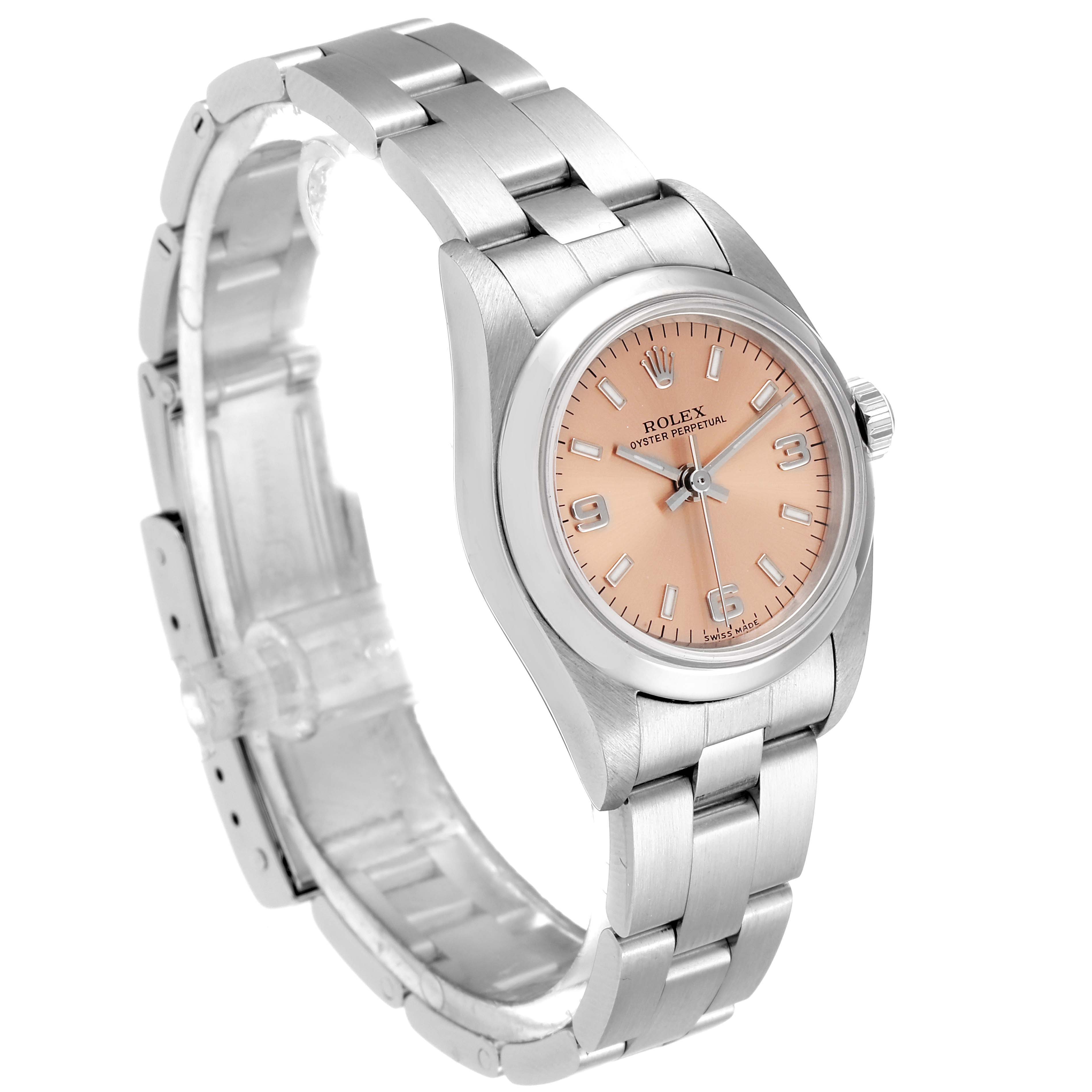 The Rolex Oyster Perpetual 76080 Women's Stainless Steel Pink Dial 76080 Women's Stainless Steel Pink Dial watch is shown at a three-quarter angle, showcasing its full bracelet and salmon-pink dial.