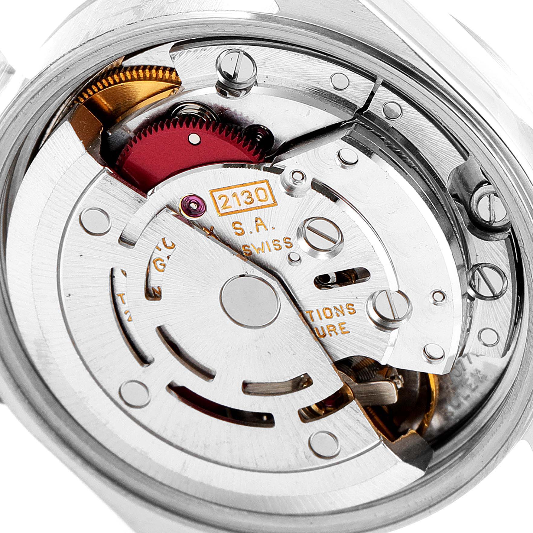 This image shows a close-up view of the movement mechanism in a Rolex Oyster Perpetual 67180 Women
s Stainless Steel Silver Dial 67180 Women
s Stainless Steel Silver Dial watch.