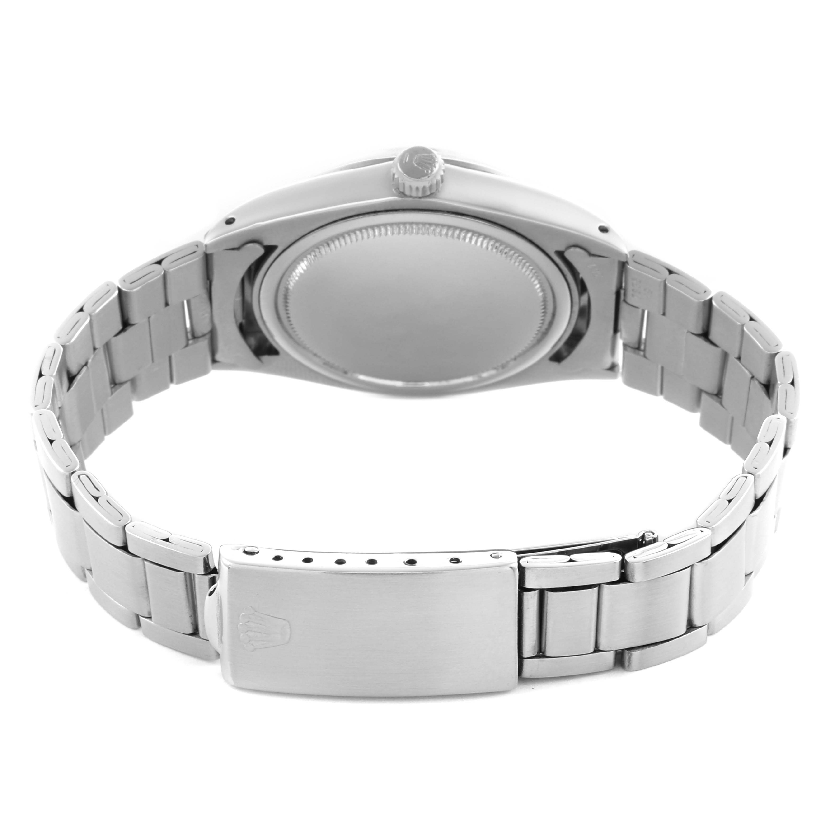 The Rolex Date 6694 Men's Stainless Steel Silver Dial 6694 Men's Stainless Steel Silver Dial watch is shown from the back, highlighting the case back, crown, and bracelet with clasp.