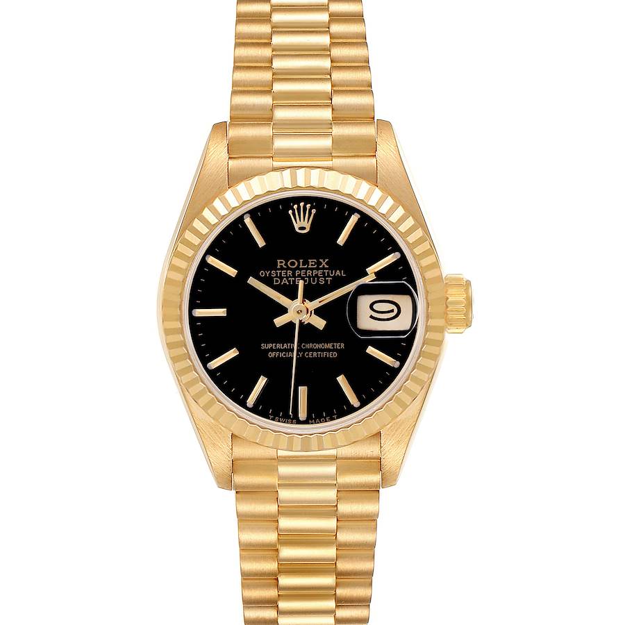 The image shows a Rolex President model watch from a front angle, highlighting its black dial, gold bracelet, and fluted bezel.