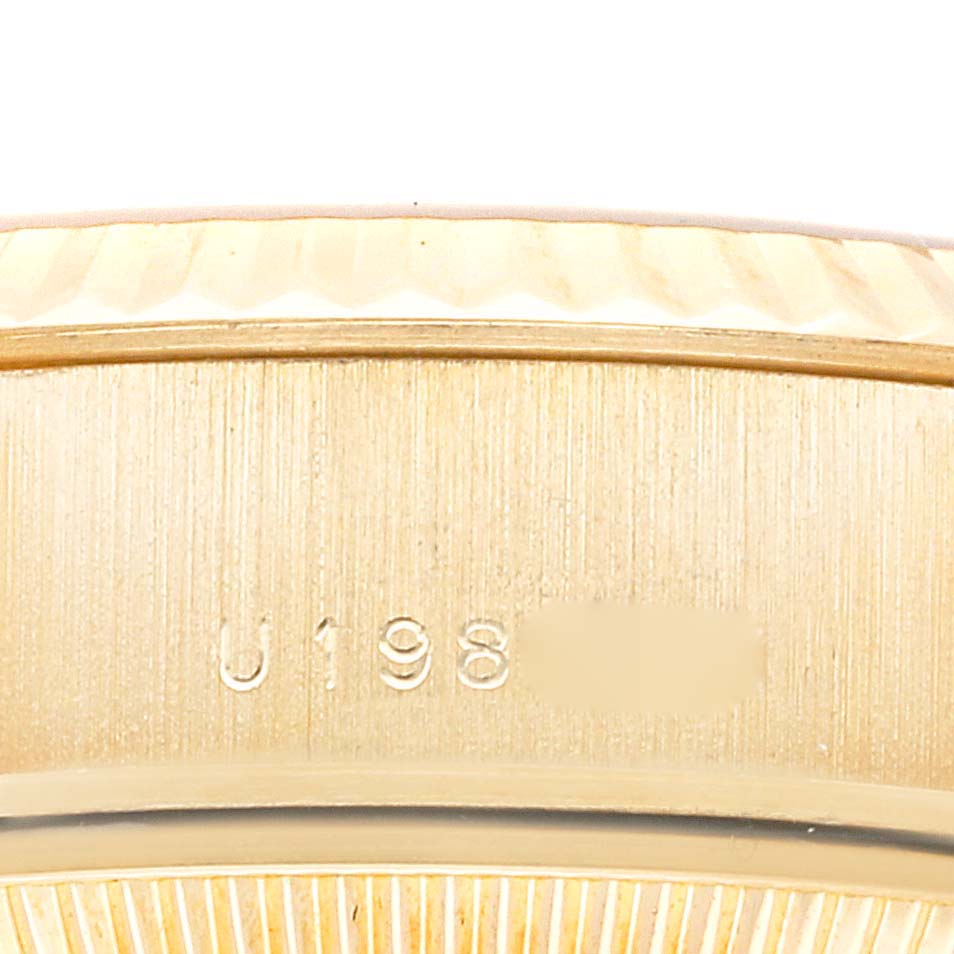 This image shows a close-up view of the serial number area of a Rolex President 79178 Women
s Yellow Gold Champagne Dial 79178 Women
s Yellow Gold Champagne Dial model watch.
