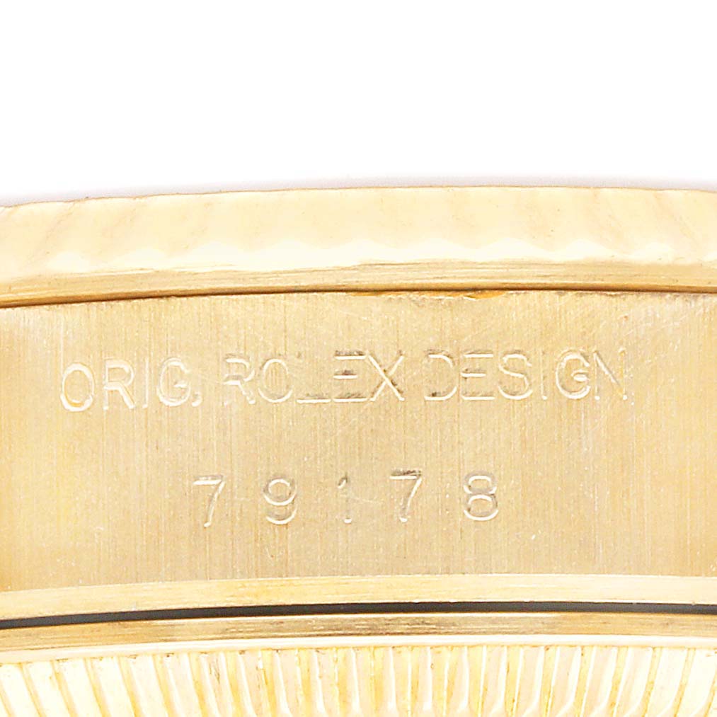 The image shows a close-up of the case side of a Rolex President 79178 Women's Yellow Gold Champagne Dial 79178 Women's Yellow Gold Champagne Dial, displaying the engraved model number.